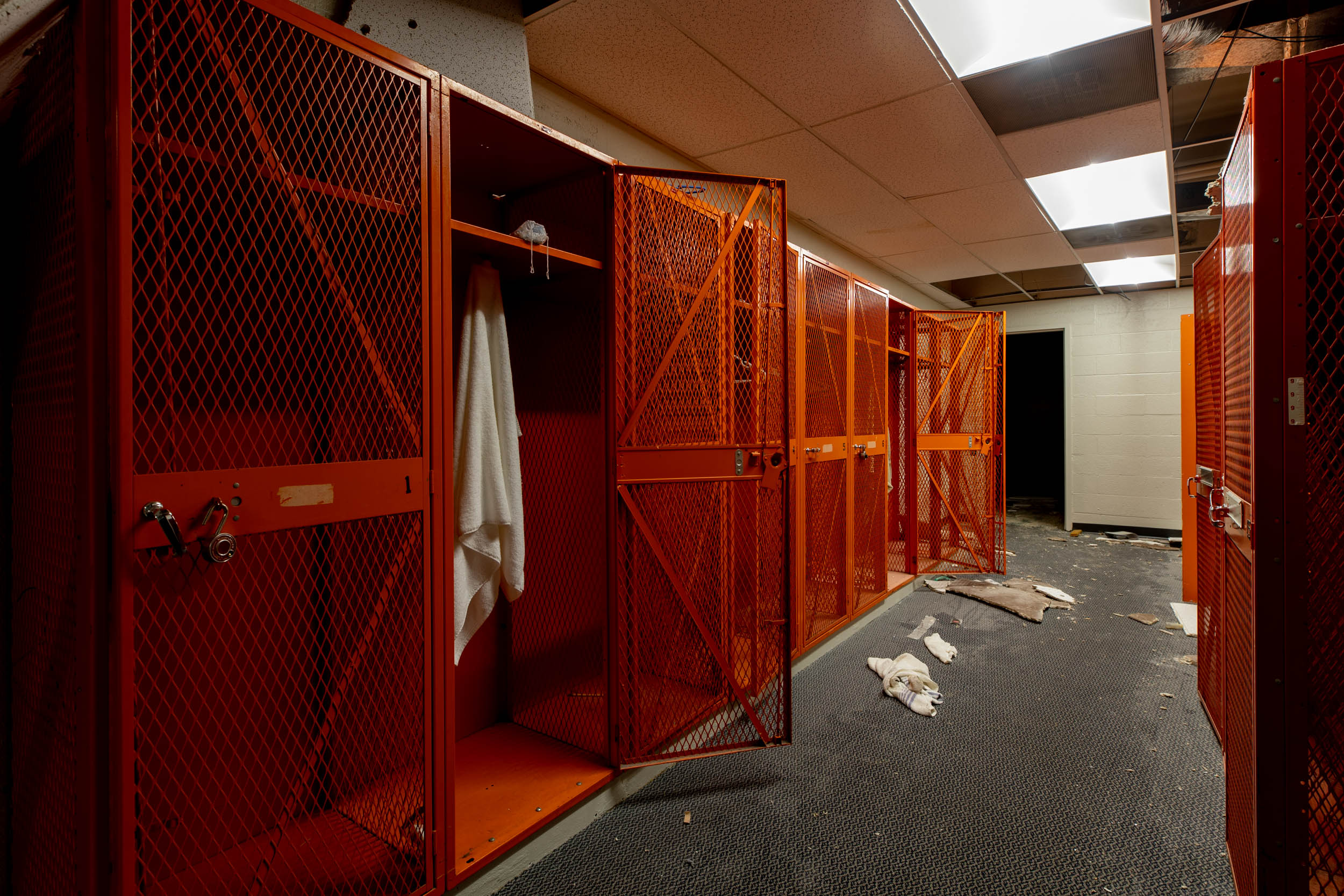 Metal Lockers with a towel hanging in one of them