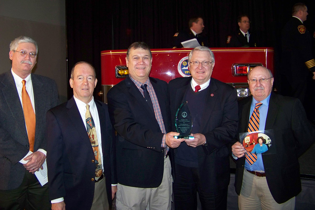 Members of the UVA fire safety team pose with State Fire Marshall Charles “Ed” Altizer, second from right, after receiving the award. The UVA team included, from left, Britt Grimm, Peter Oprandy, Gerald Drumheller and Clinton Wingfield.