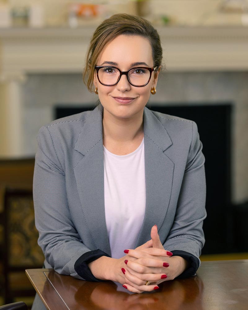 A headshot Lily Ellis an assistant professor of leadership and organization with UVA’s Darden School of Business