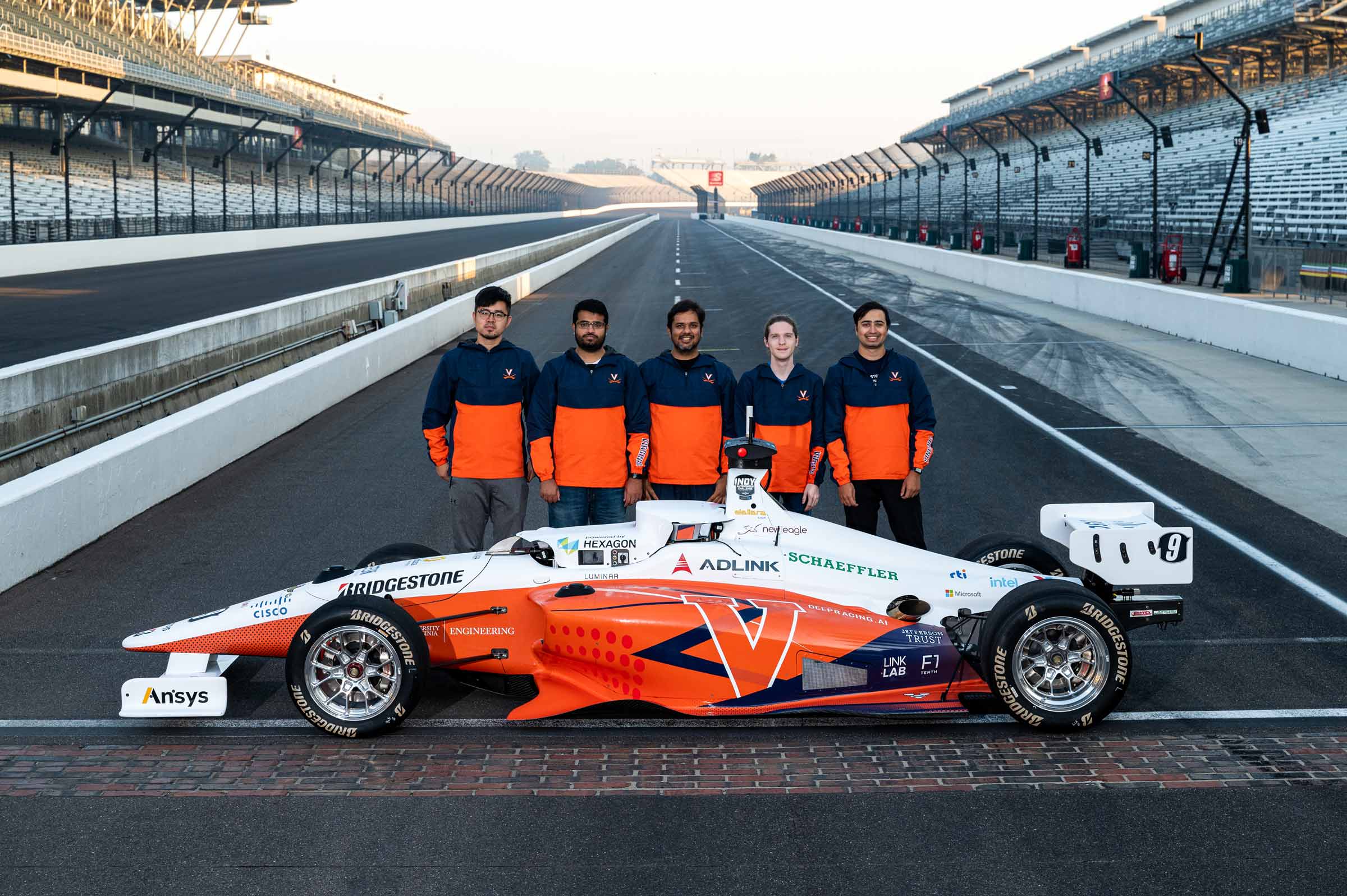 Group portrait of Behl and pit crew