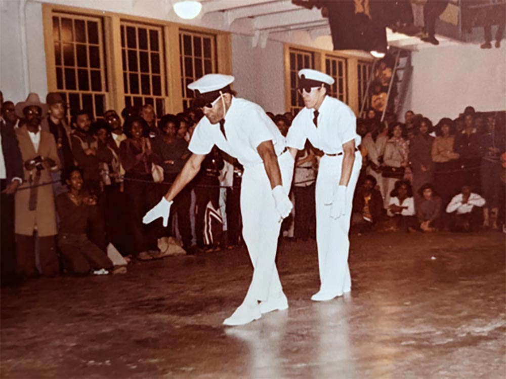 Two members of the UVA chapter of Omega Psi Phi performing a step show