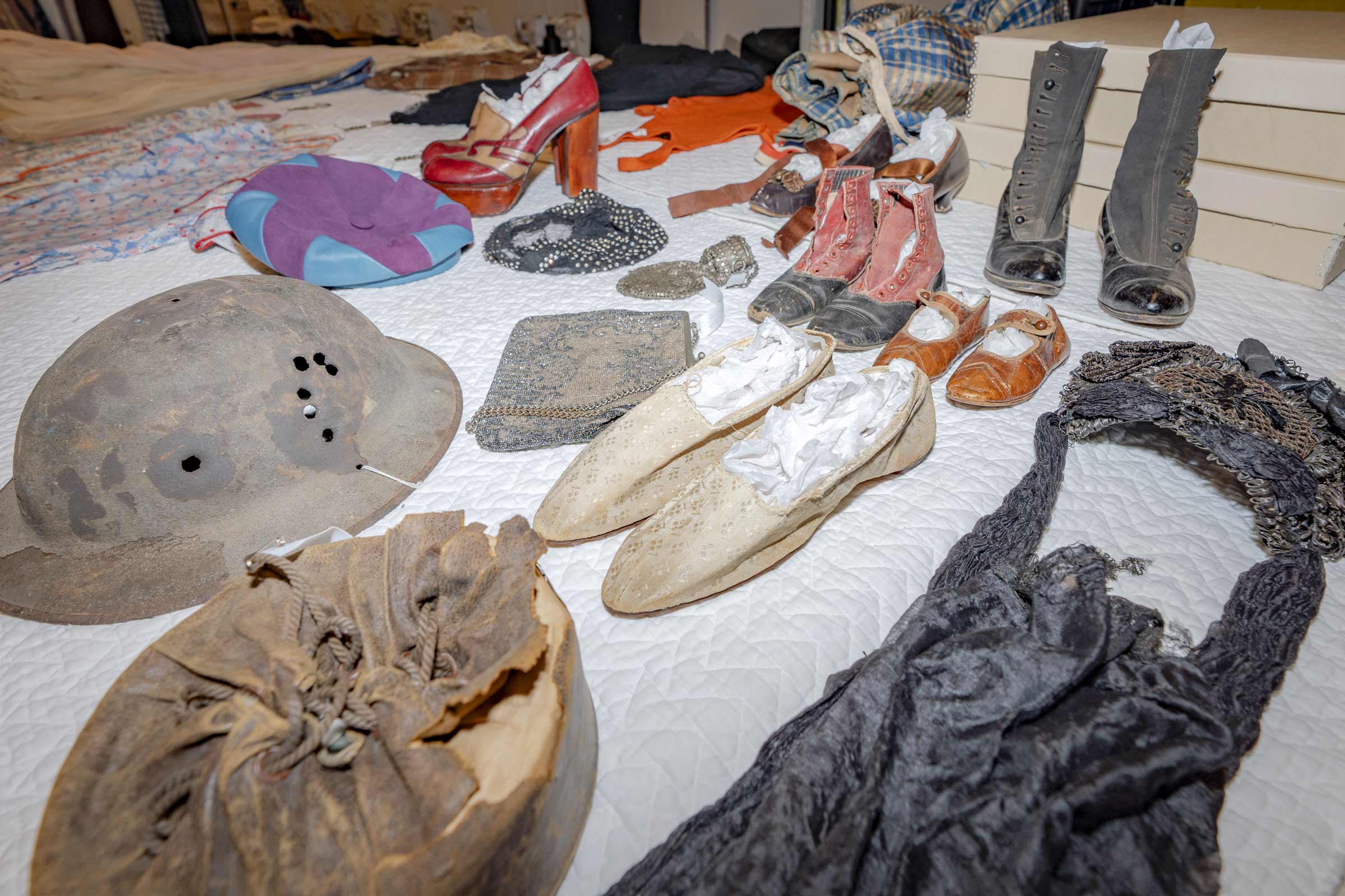 Various older articles of clothing on a table