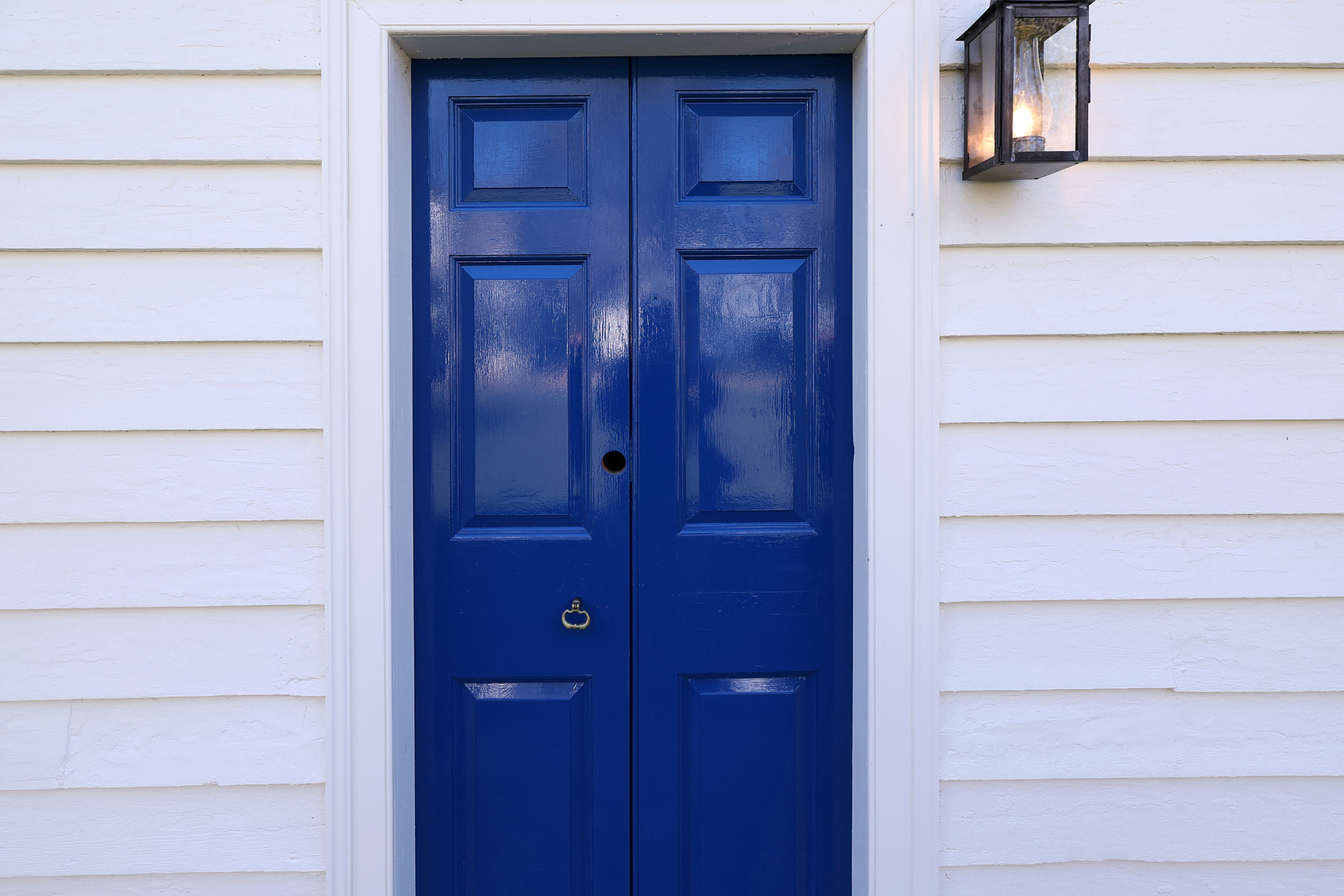 An exterior blue door