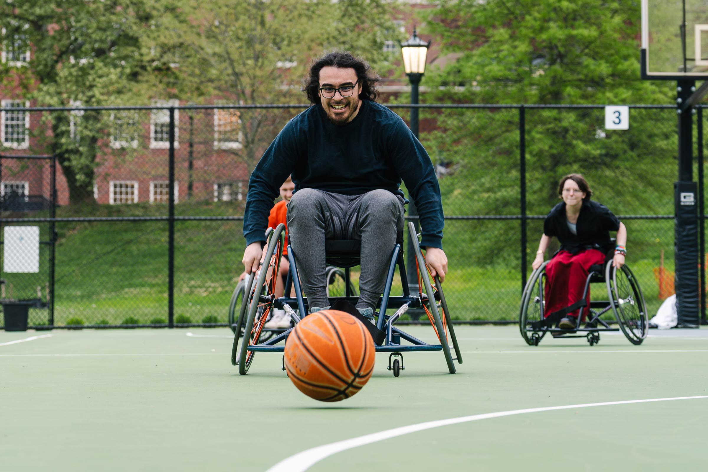 Picture of an individual with disabilities playing wheelchair basketball.