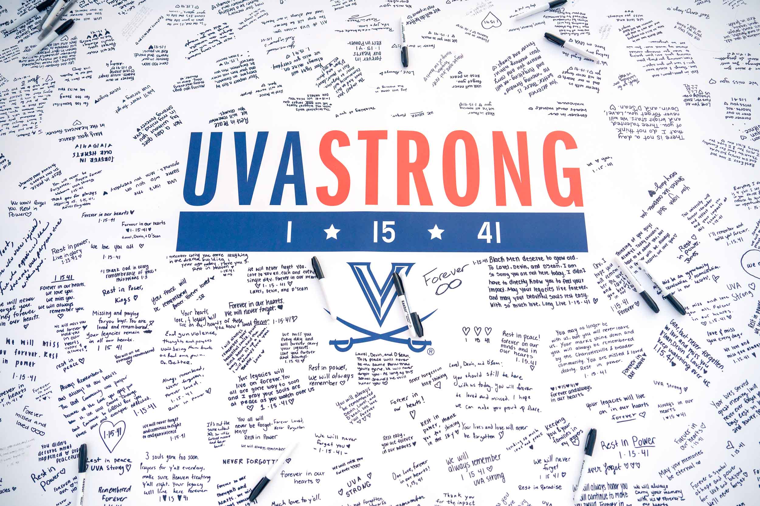 The UVA Strong banner on the Lawn covered in handwritten messages