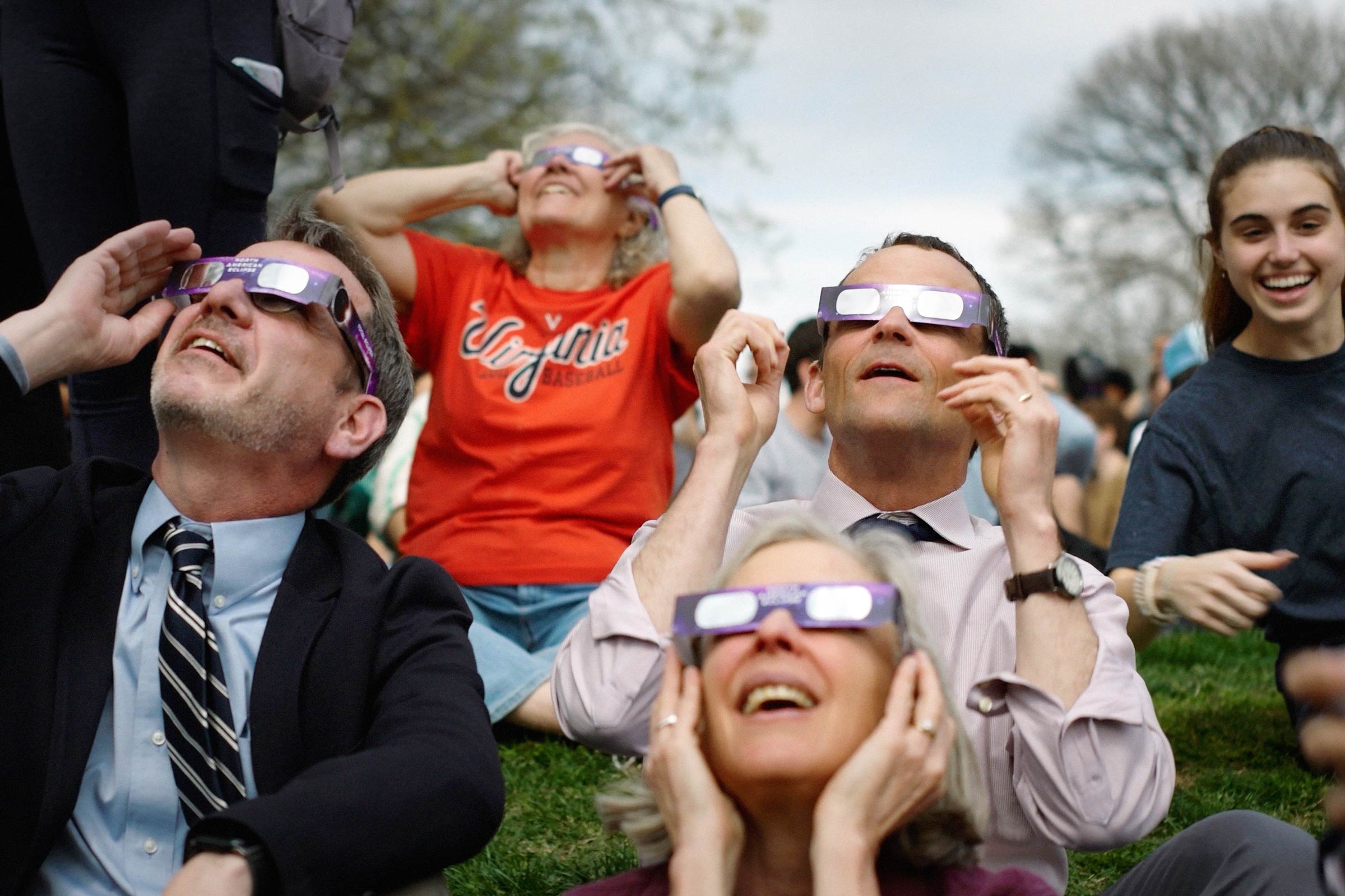 Jim Ryan and other use glasses to view the Eclipse