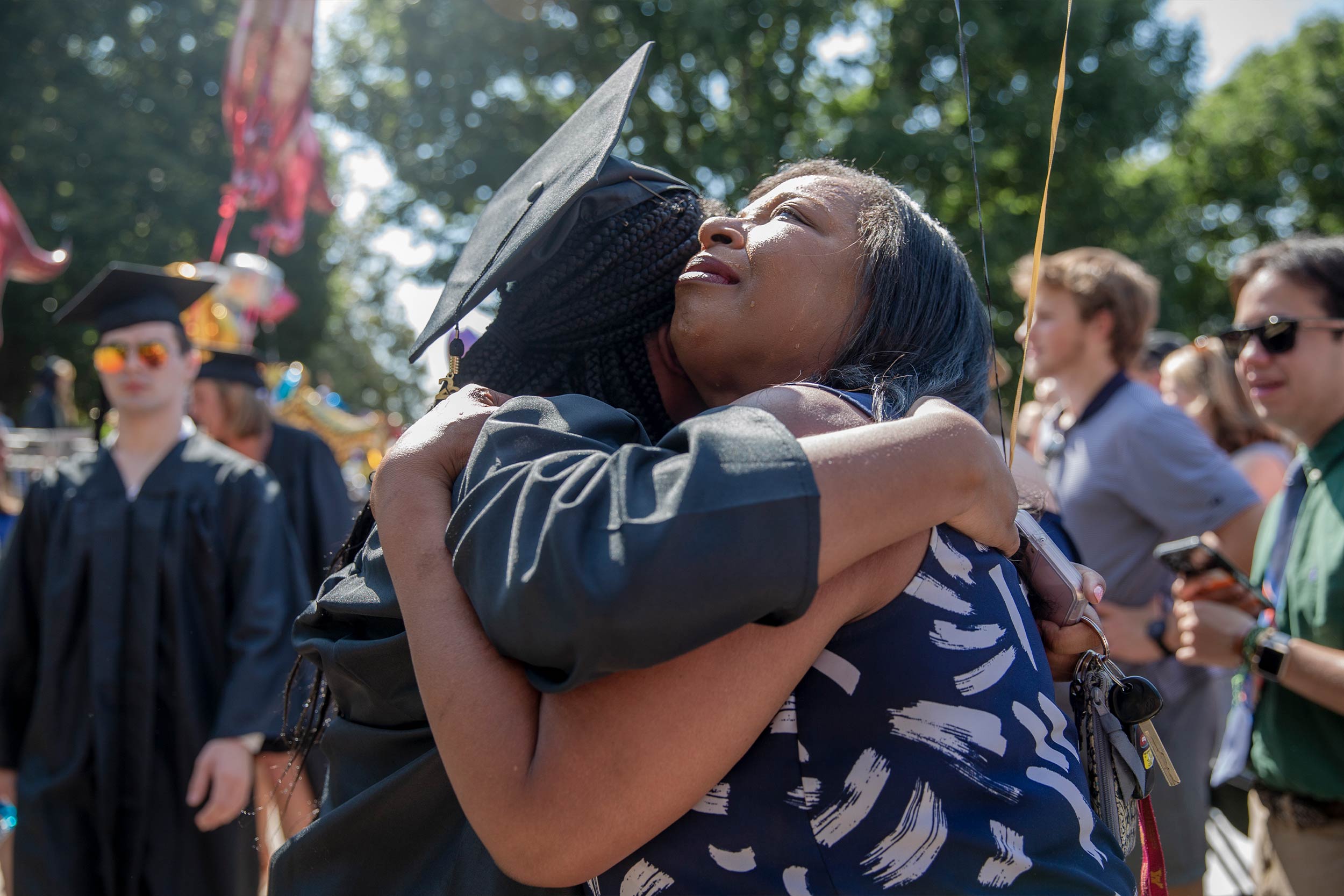 Graduate hugs her mother