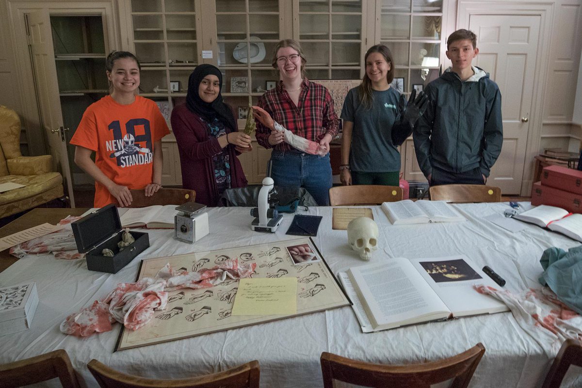 From left, UVA students Emily Campbell, Samreen Azam, Elizabeth Whitworth, Carly Hummer and Spencer Barnes were happy to solve the game in fewer than 45 minutes. 