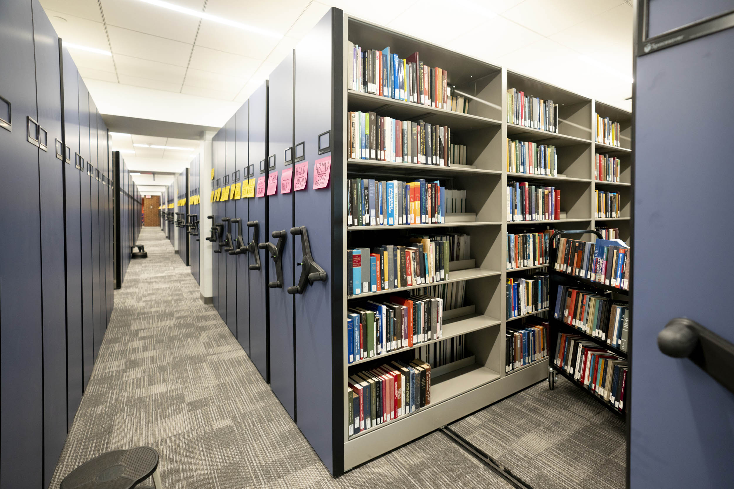 Blue moveable bookshelves in Clemons Library
