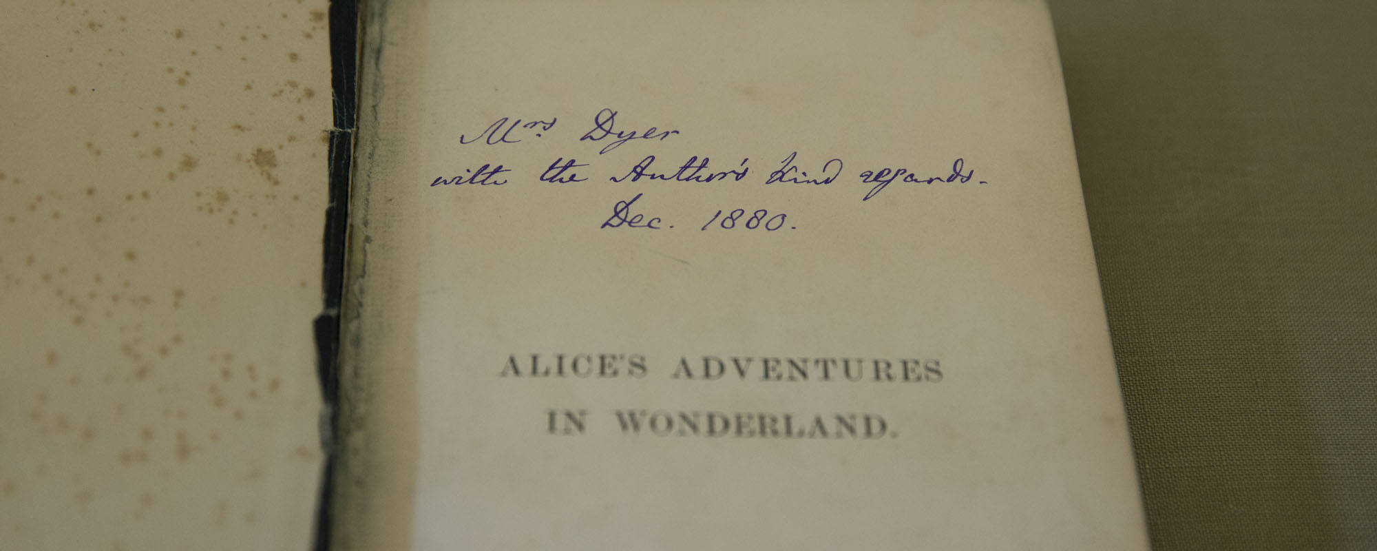 Charles Dodgson, aka Lewis Carroll, signed the copy he gave his landlady in 1880 “with the Author’s kind regards.” It seems he regularly inscribed his books from the “author” rather than choose between his penname and real name, student curator Susan Swic