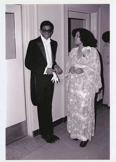 Thomas Dickerson and Christine Mckee talking at a ball