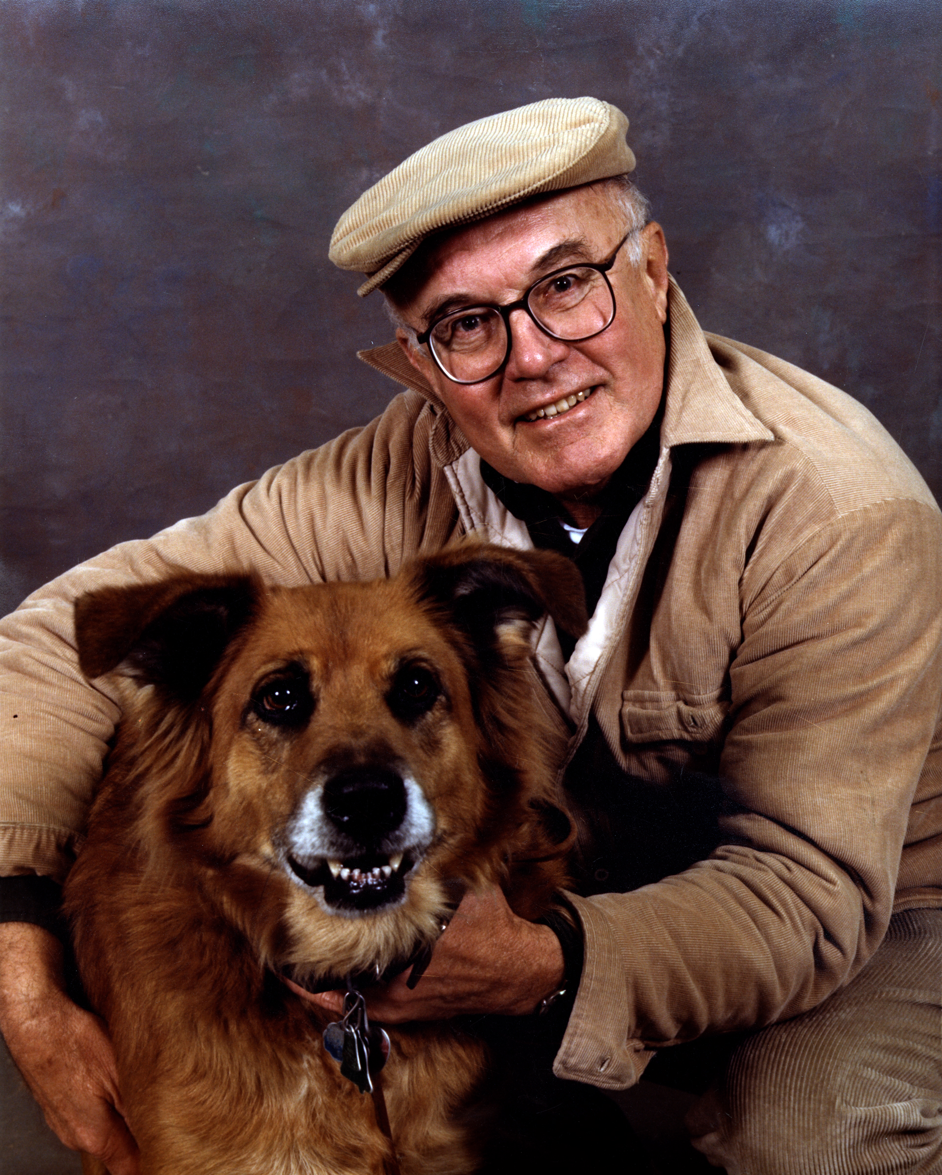 Richard K. Ernst with his dog smiling at the camera