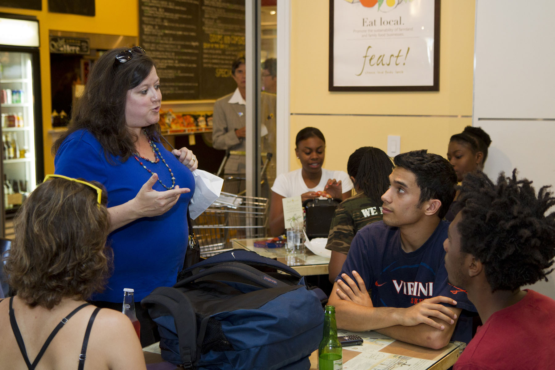 Lisa Shutt talks to her Anthropology students in a diner