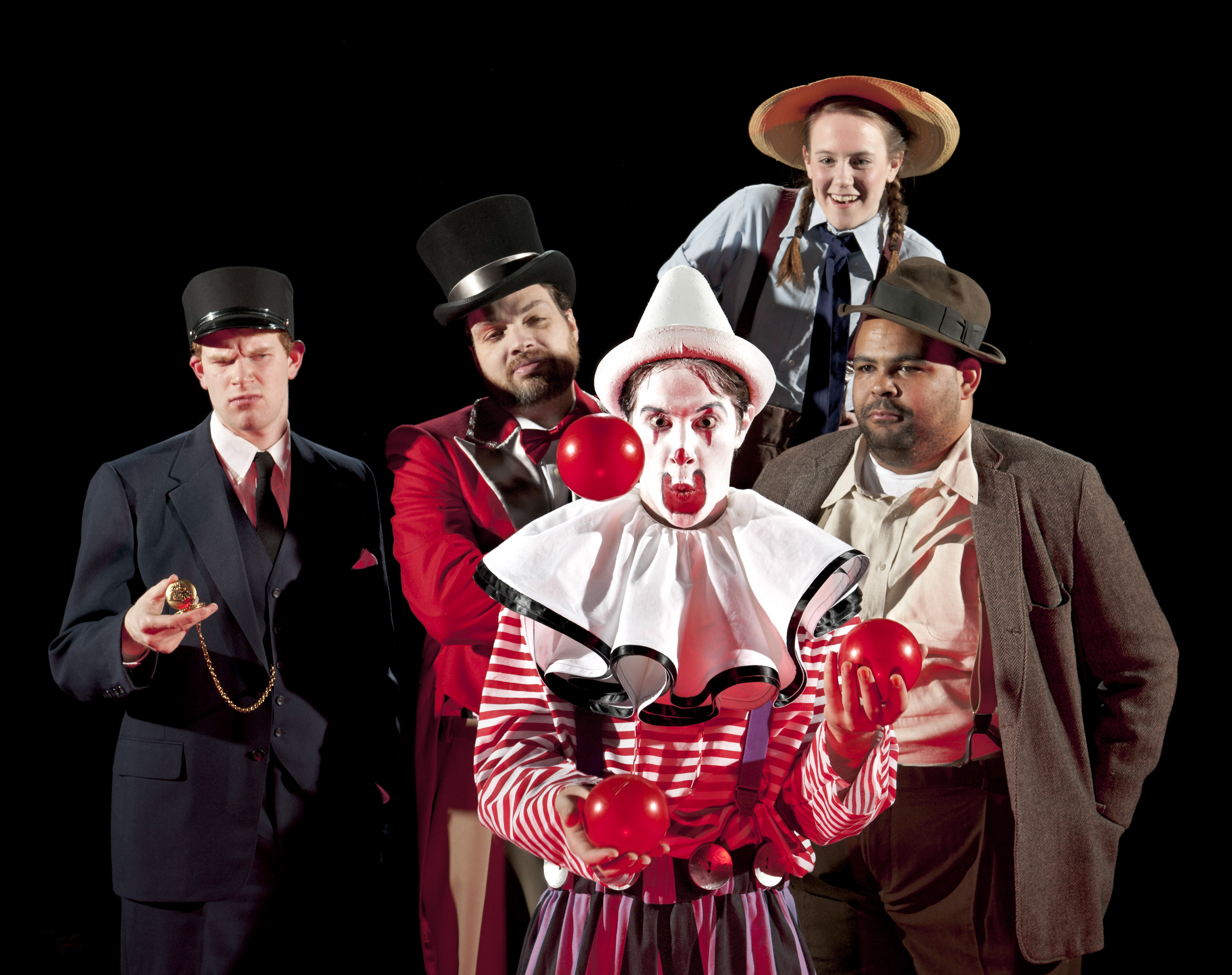 Engineer (Daniel Prillaman), Ringmaster (Jay Colligan) and Townspeople (Julia Addis and Christopher Murray) look on as the Circus Clown (Michael Goldstein) juggles