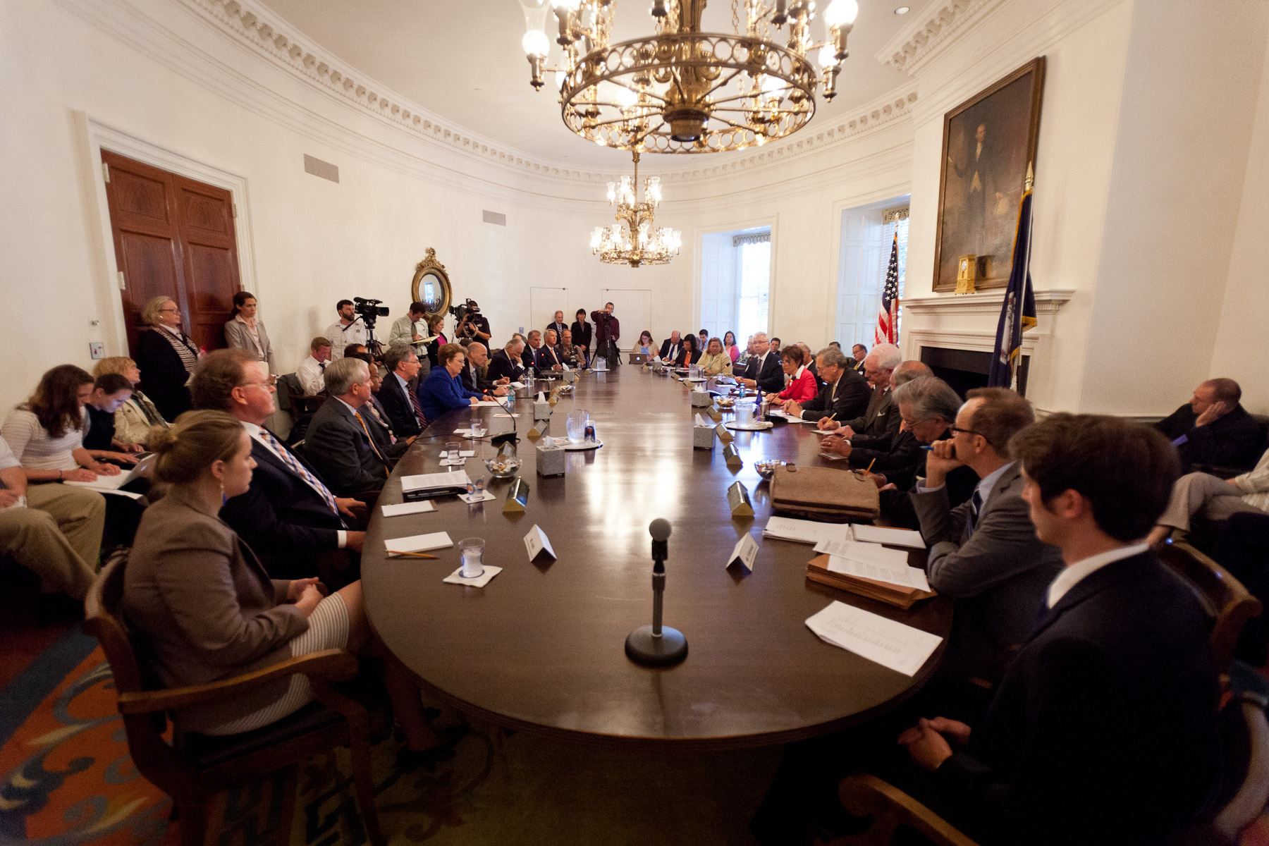 U.Va. Board of Visitors sitting at a round table