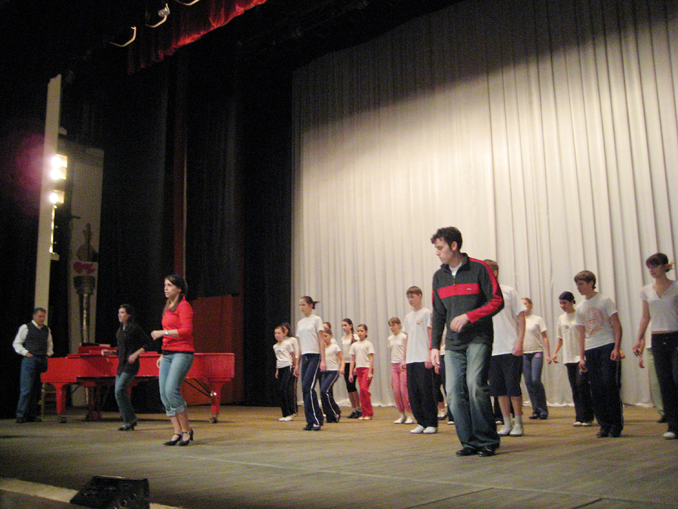 Drama students on stage dancing