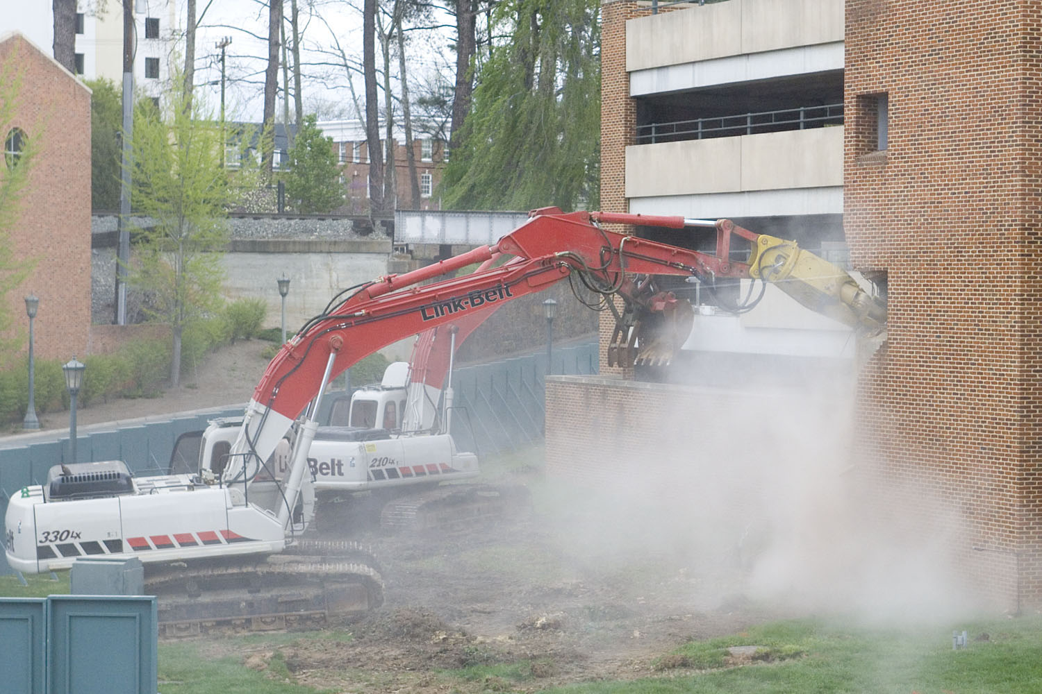 construction equipment tearing down a parking garage