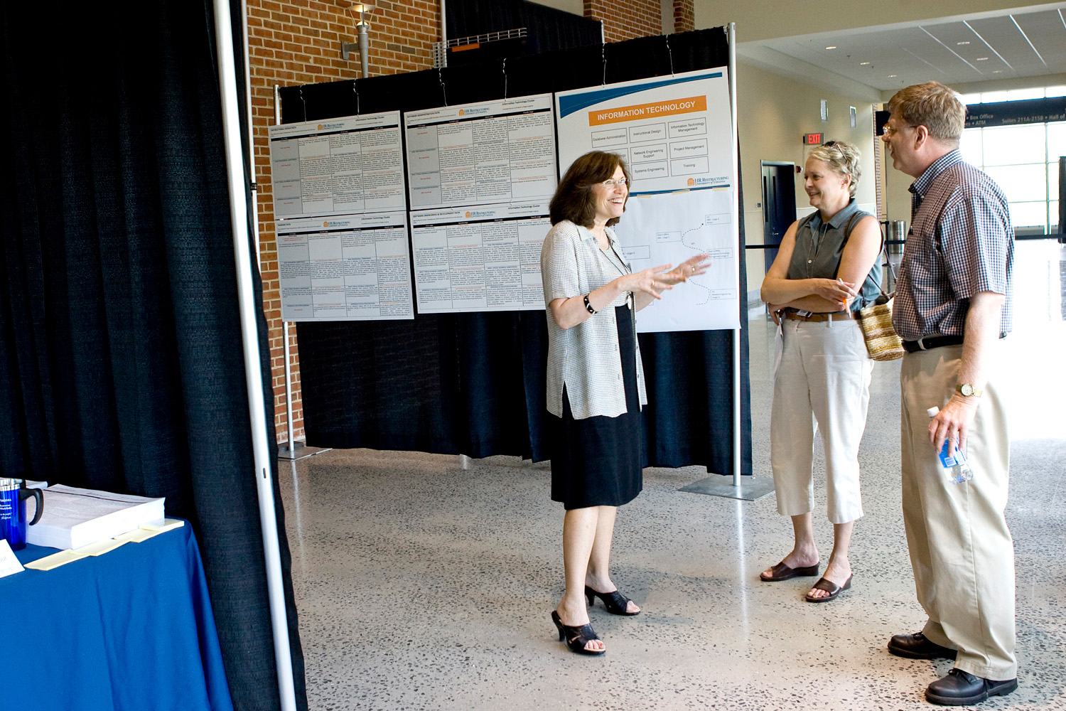 Susan Carkeek, left, talks to visitors during an expo