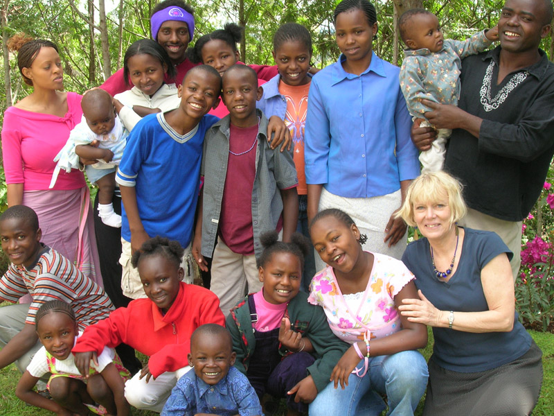 Sharon Davie (right) takes a group photo with the people of the Watoto Village