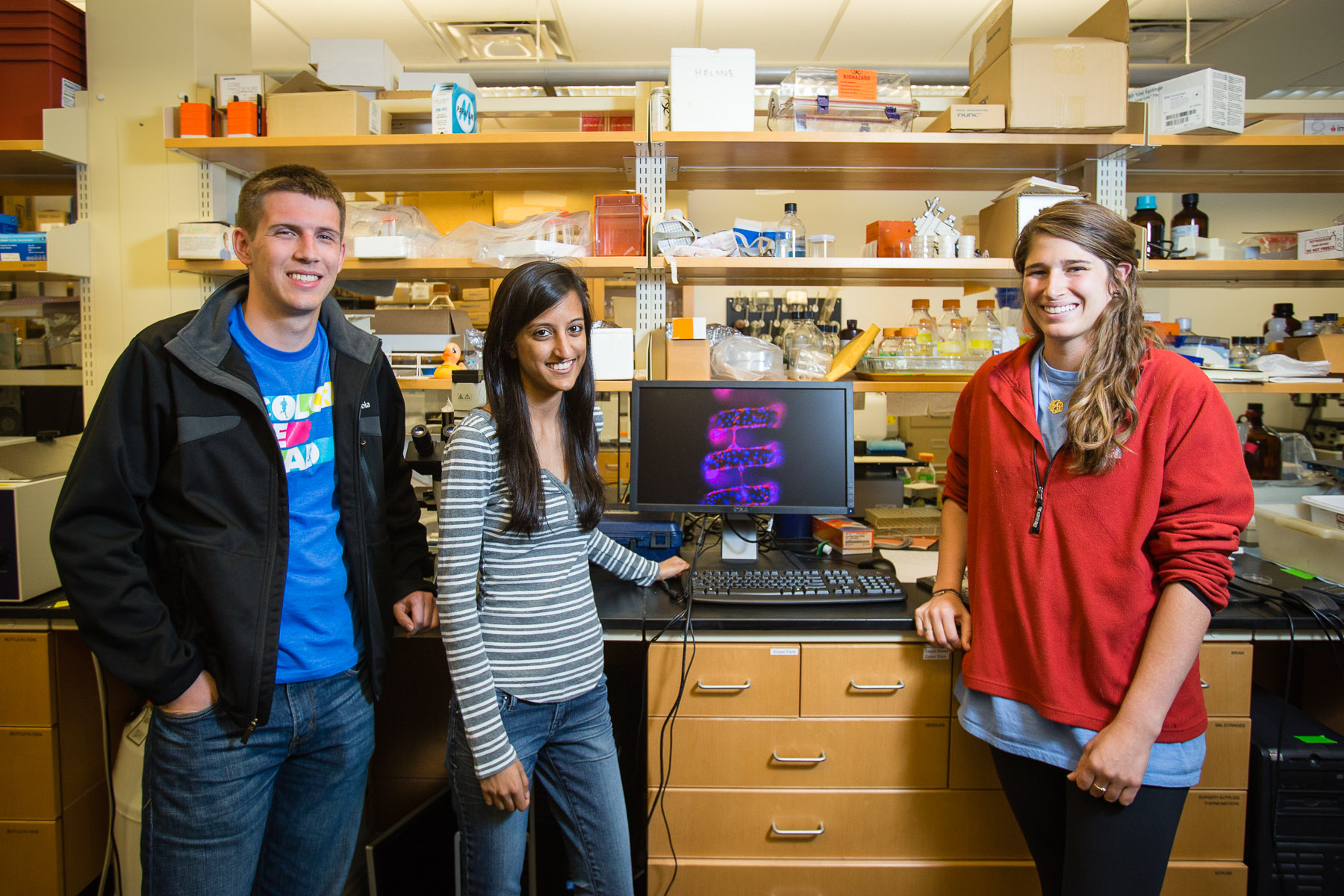 Group photo left to right; Brian Griffin, Shipra Maheshwari and Molly Jenner smile in a lab