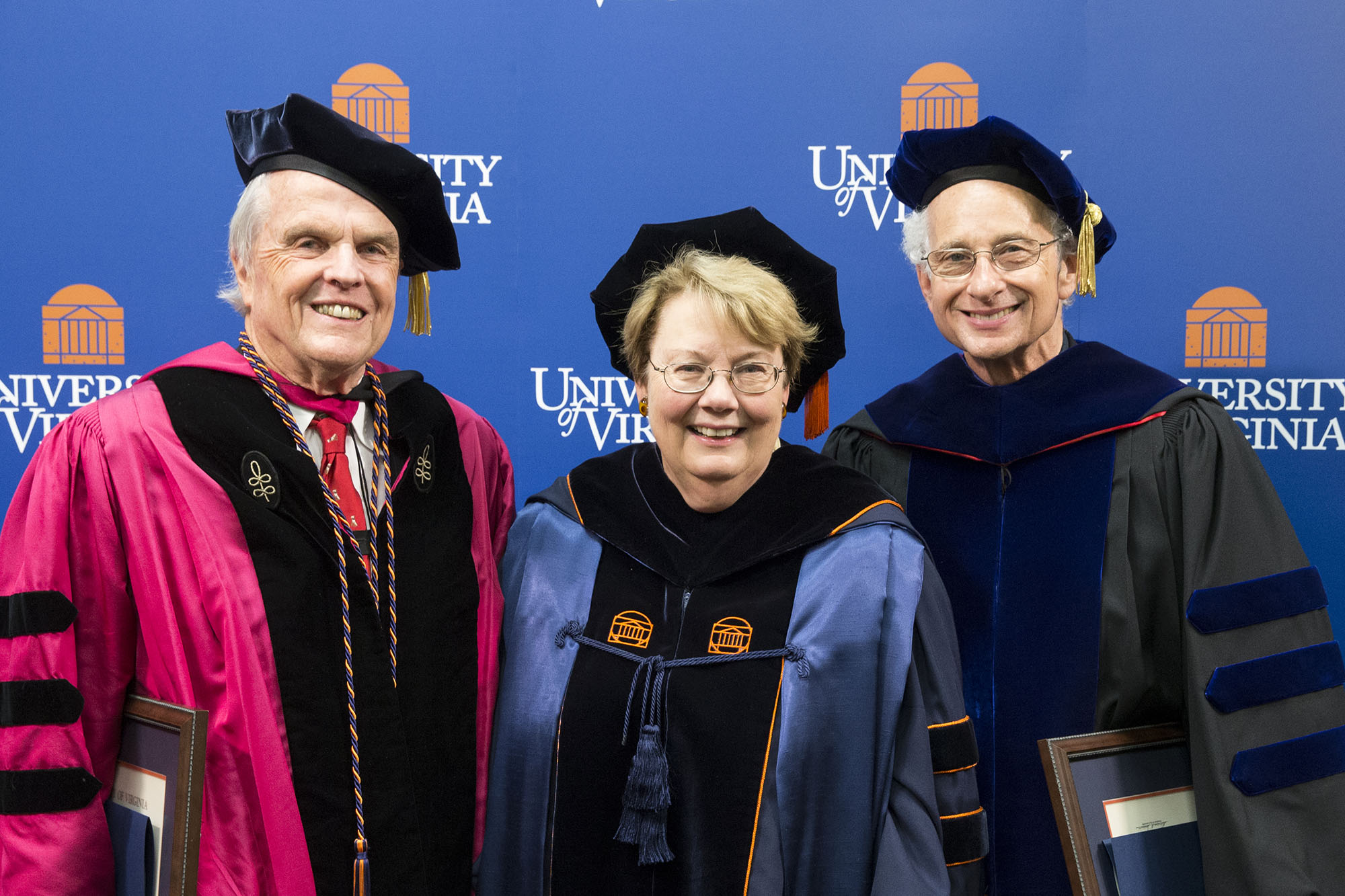Group dressed in graduation attire.  photo left to right: Alexander B. Horniman and Melvyn P. Leffler,  with U.Va. President Teresa A. Sullivan.