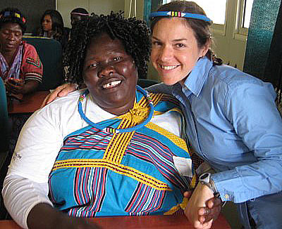 Christina Luckett, right, and an African nurse smile together