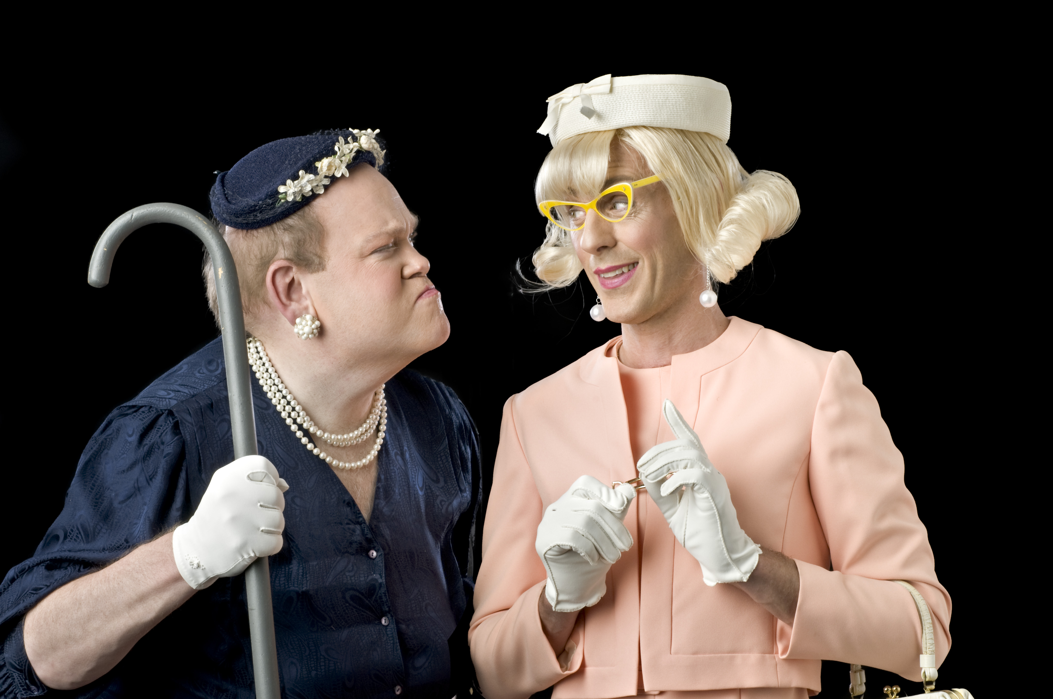 Evan Bridenstine as Pearl Burras (left) and John Paul Scheidler as Vera Carp (right) look at each other in their costumes