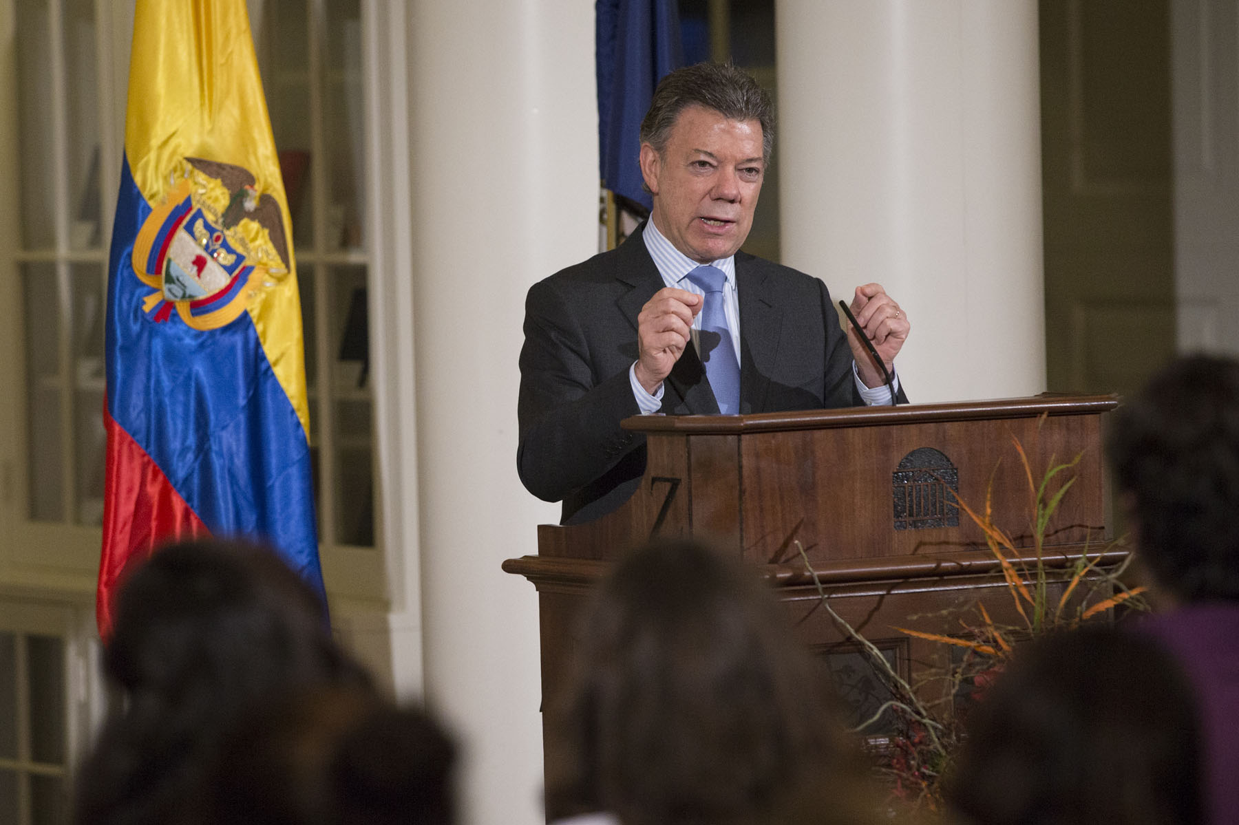 Juan Manuel Santos speaking at a podium