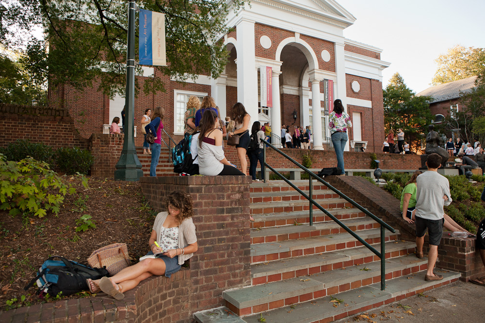 Students walking, standing, and and sitting on the steps of the Fralin Museum