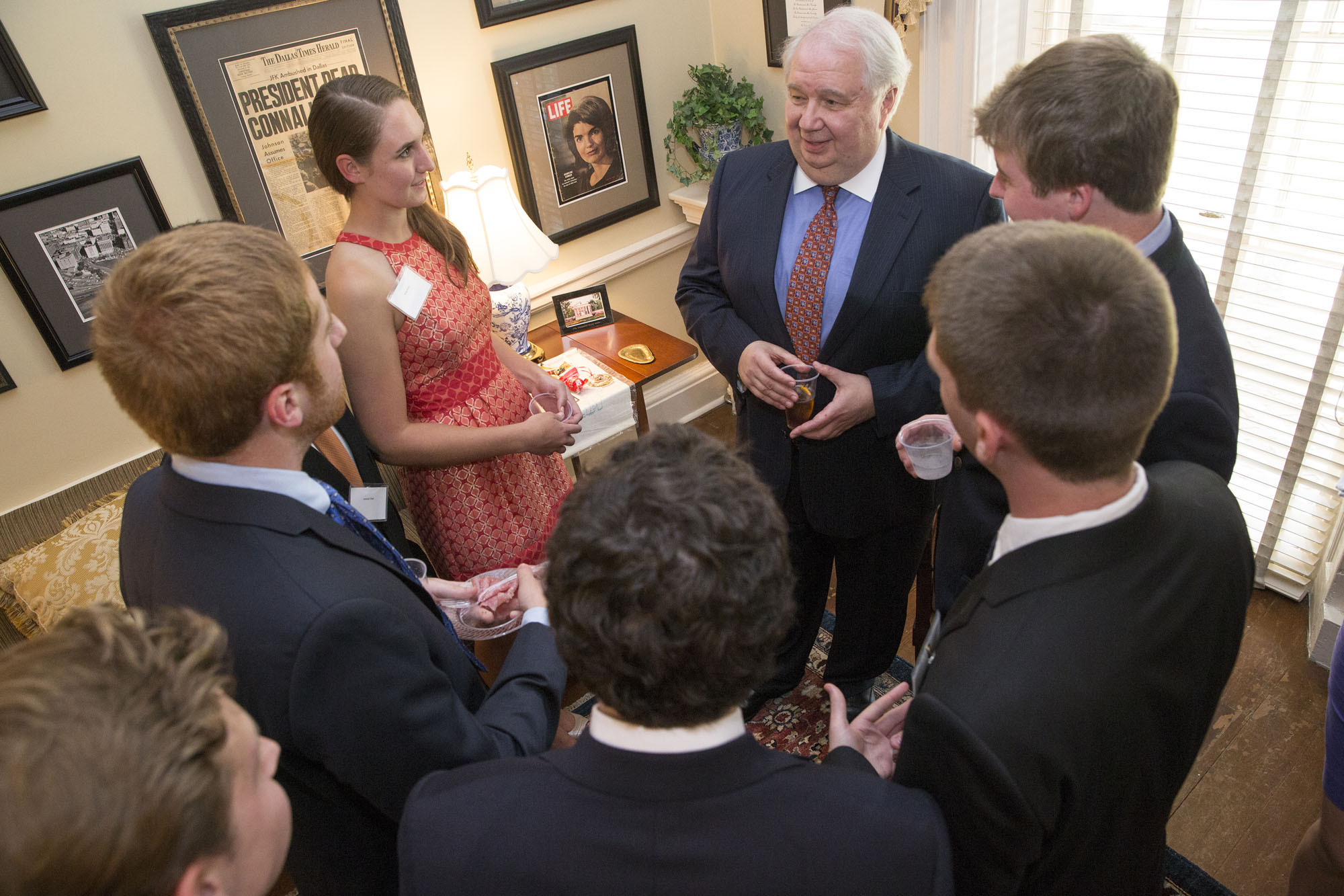 Russian ambassador standing talking to a group of students in a circle
