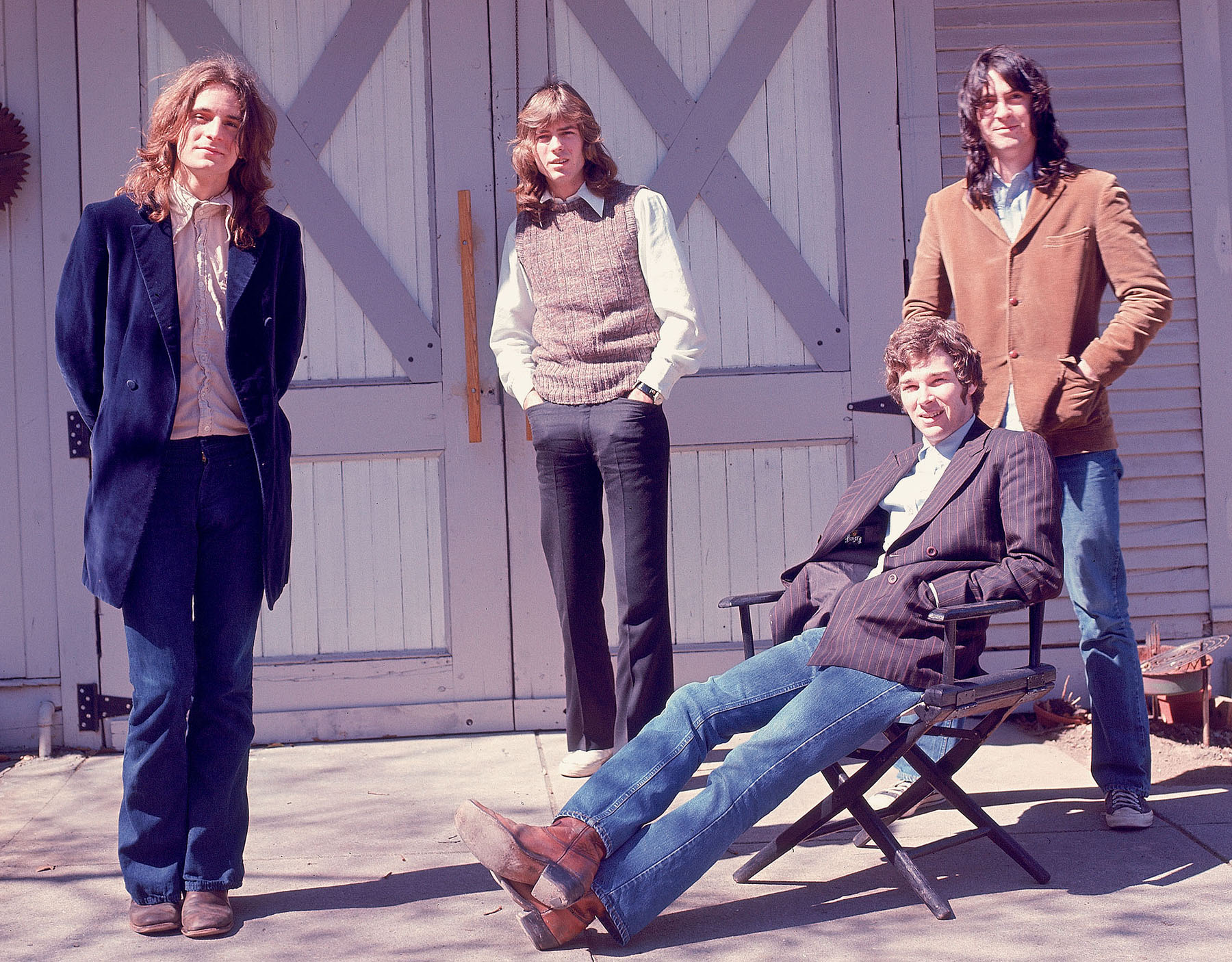 Alex Chilton, Jody Stephens, Chris Bell and Andy Hummel pose together smiling at the camera