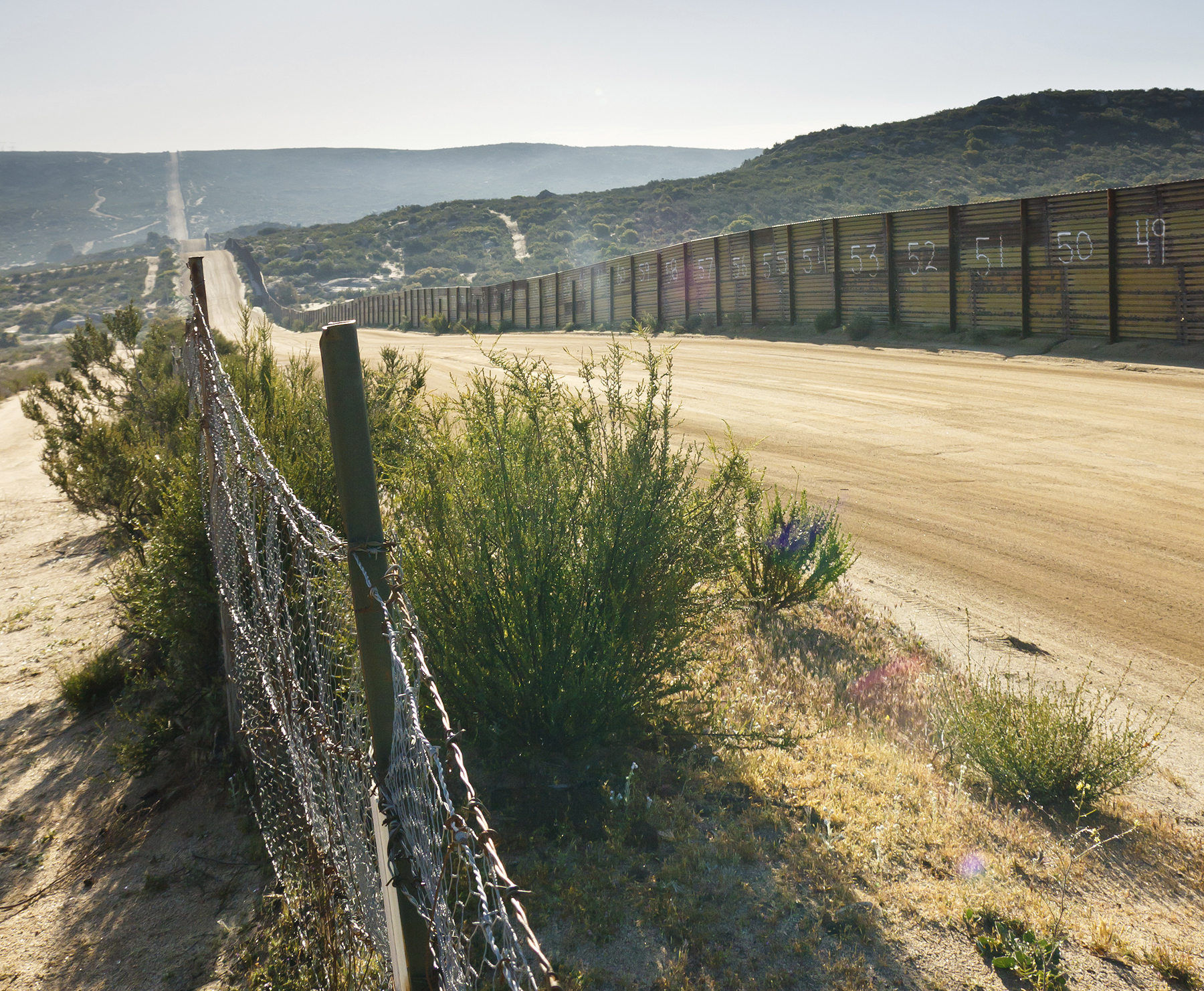 Long dirt road at the Mexico-US Border