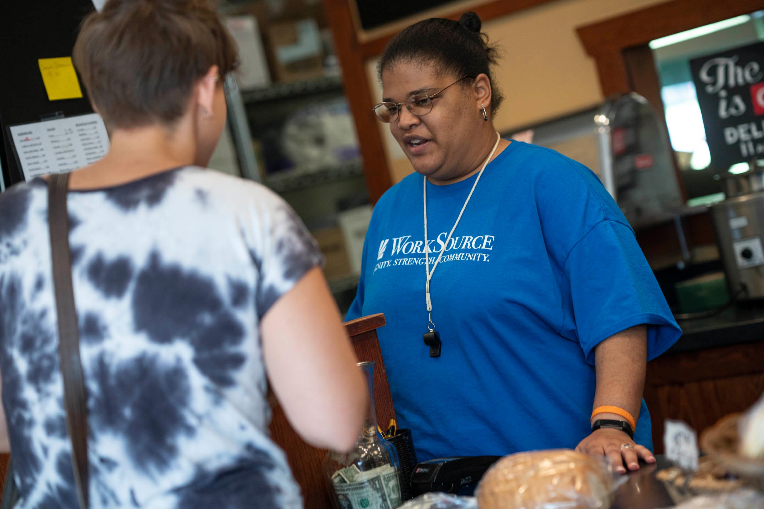 Raquel Terrell helps a customer checkout