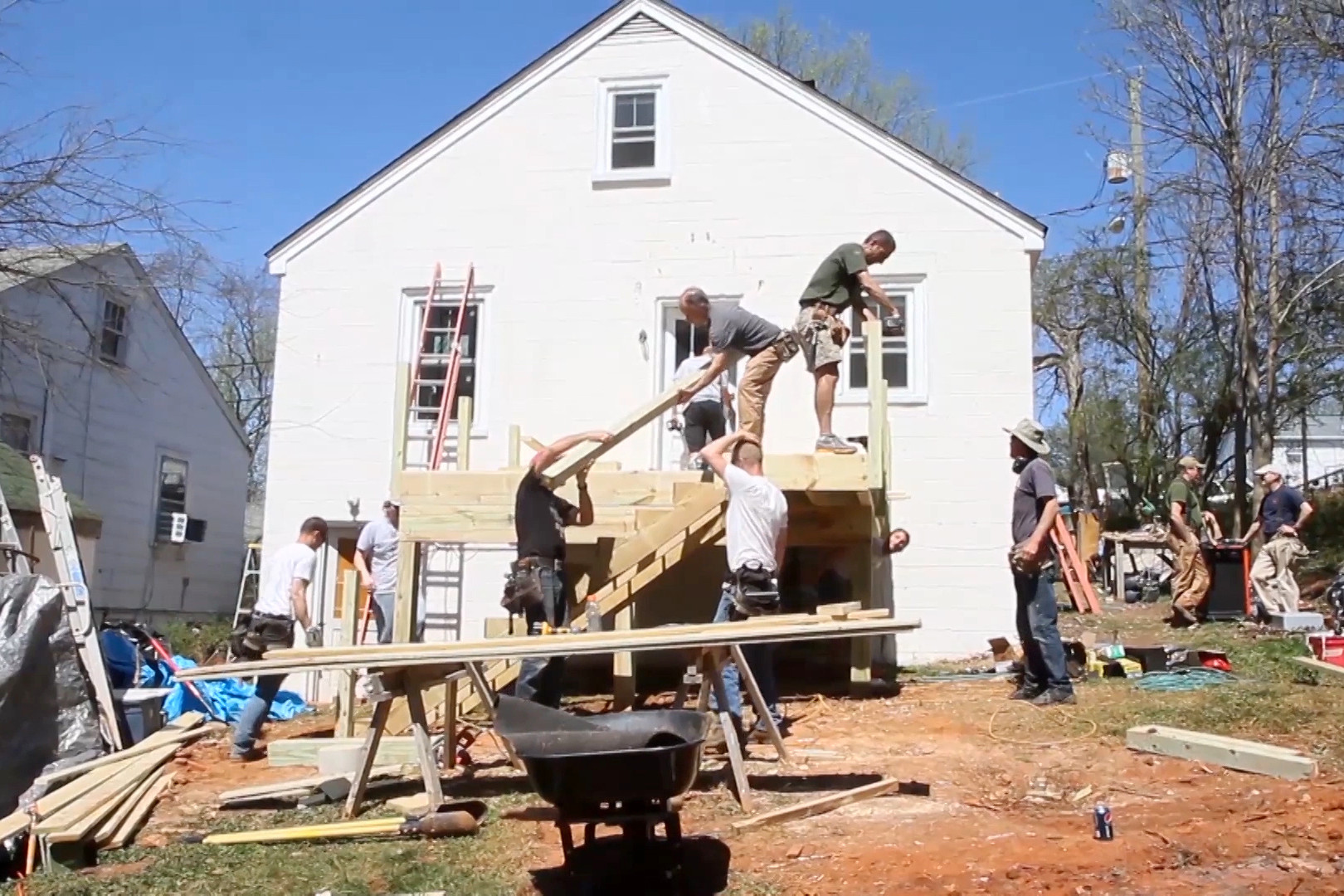 UVA employees working on building a deck