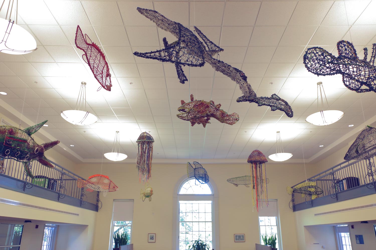 Sculptures made from “ghost nets” hang from the ceiling 