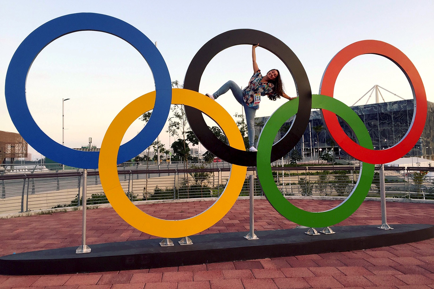 Alexandra D’Elia poses with the Olympic rings in Rio de Janeiro