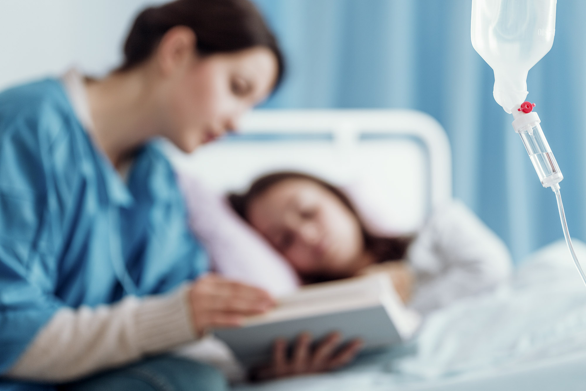 Nurse reading to patient