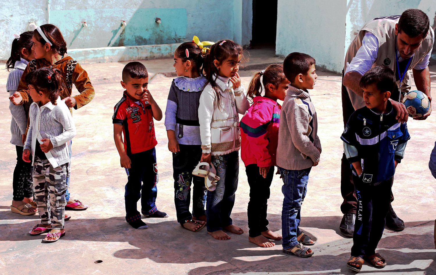 Refugee children assemble at a camp in Iraqi Kurdistan