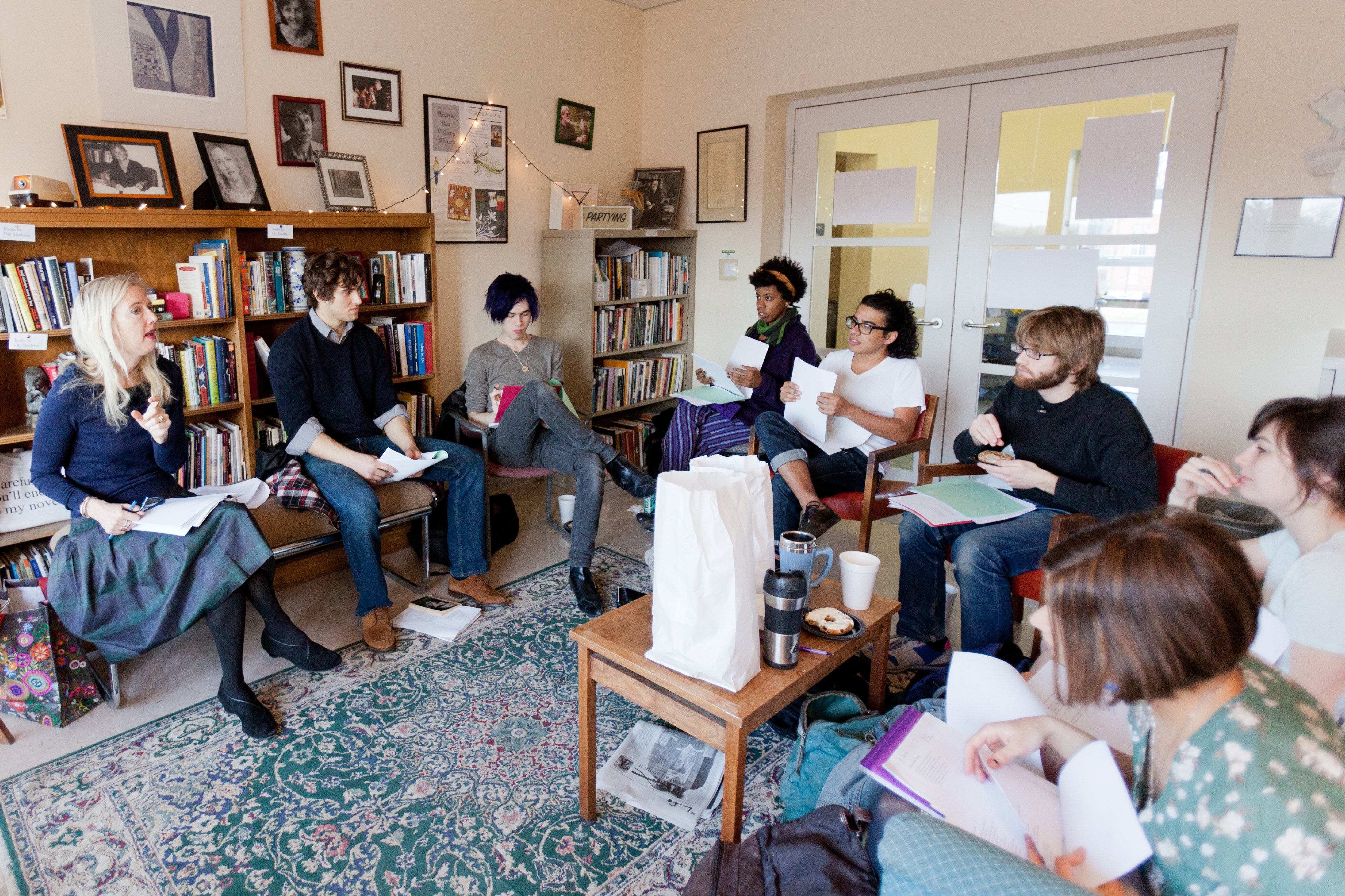 Lisa Russ Spaar poetry class sits in a circle discussing a poem they read