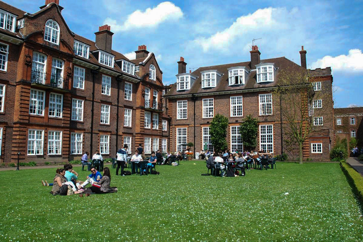 Students sit at tables outside at Regent’s Park in central London