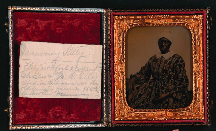 Hand written note and picture of an African American woman, Mammy Kitty, in a box