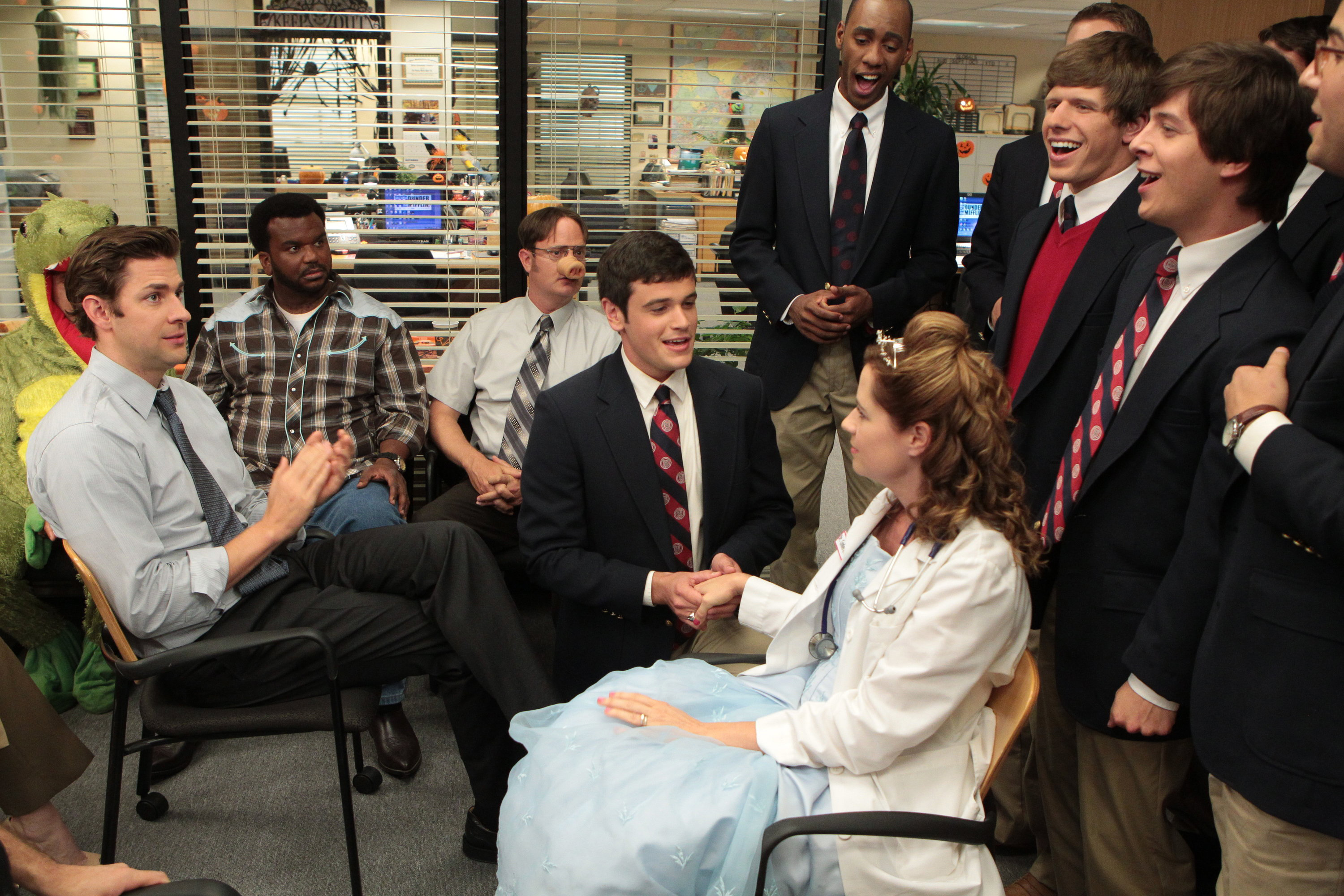 Nicholas Cafero (center) singing to pam on the office