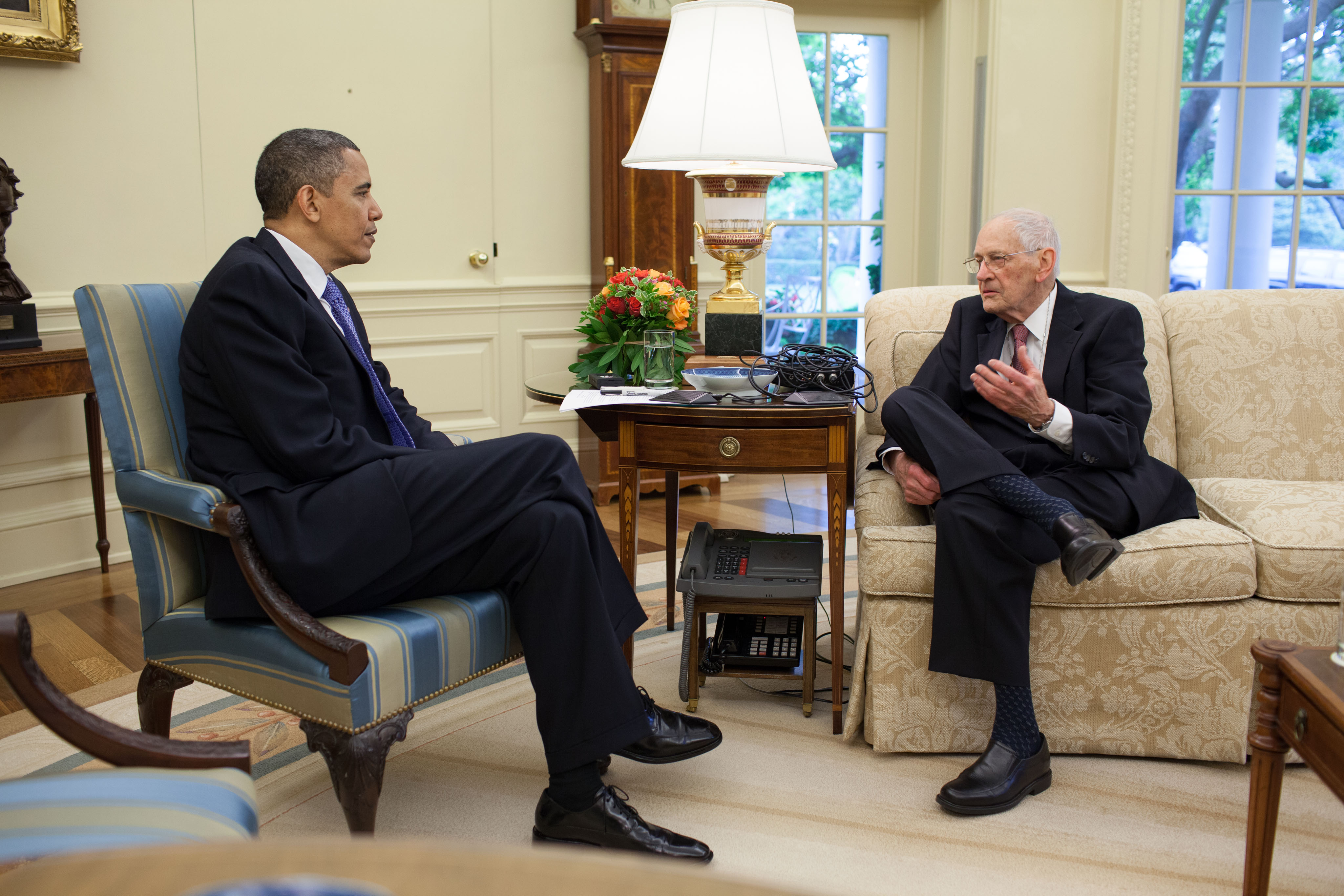 James Sterling Young, right, sits on a couch talking to President Barack Obama in the Oval Office