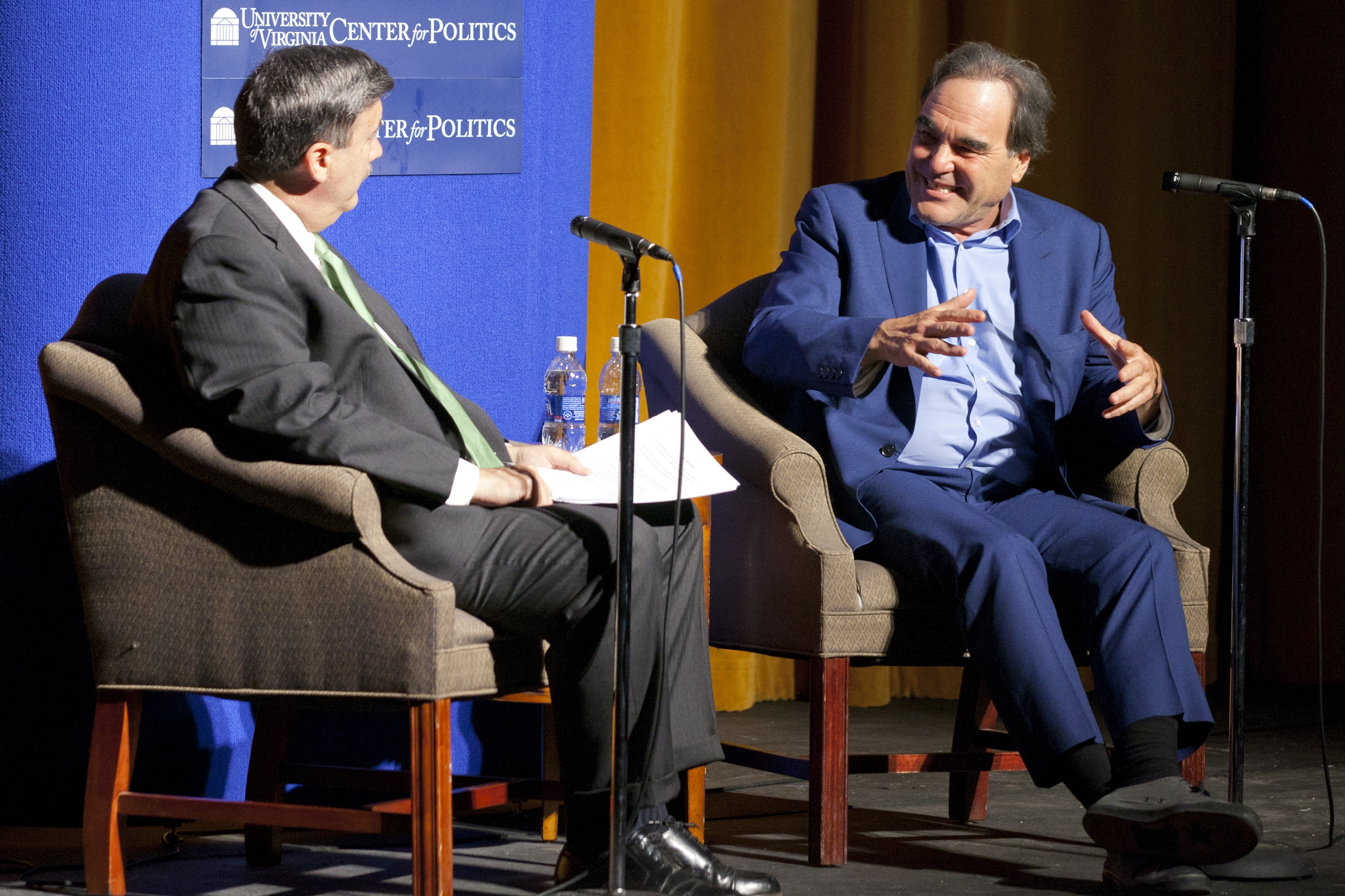 Larry Sabato interviews director Oliver Stone on stage during the Virginia Film Festival