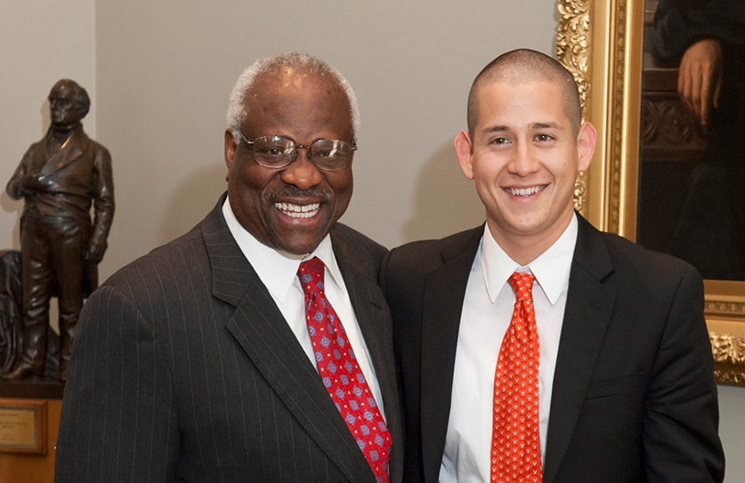 Marco Segura and Justice Thomas pose together smiling
