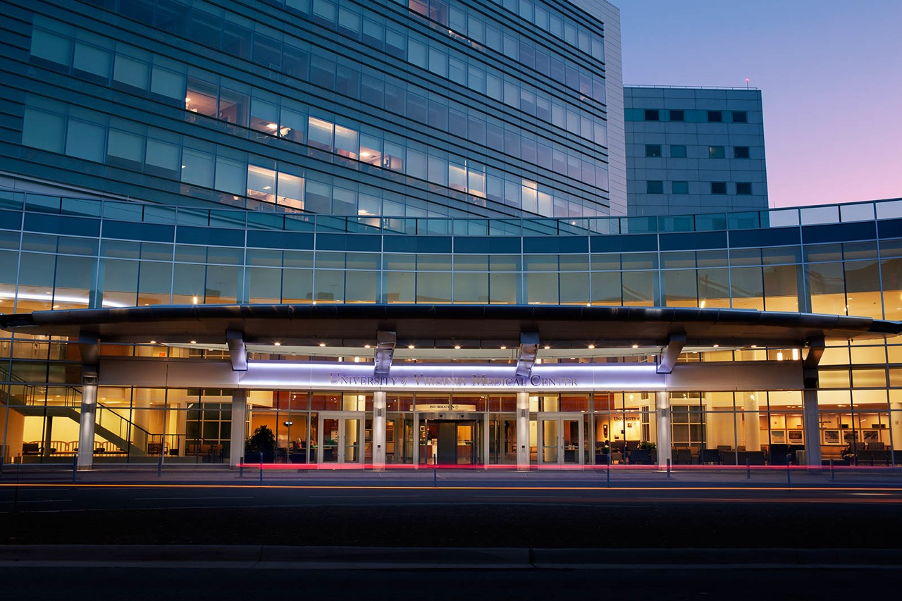 Entrance to the UVA hospital lit up at dusk
