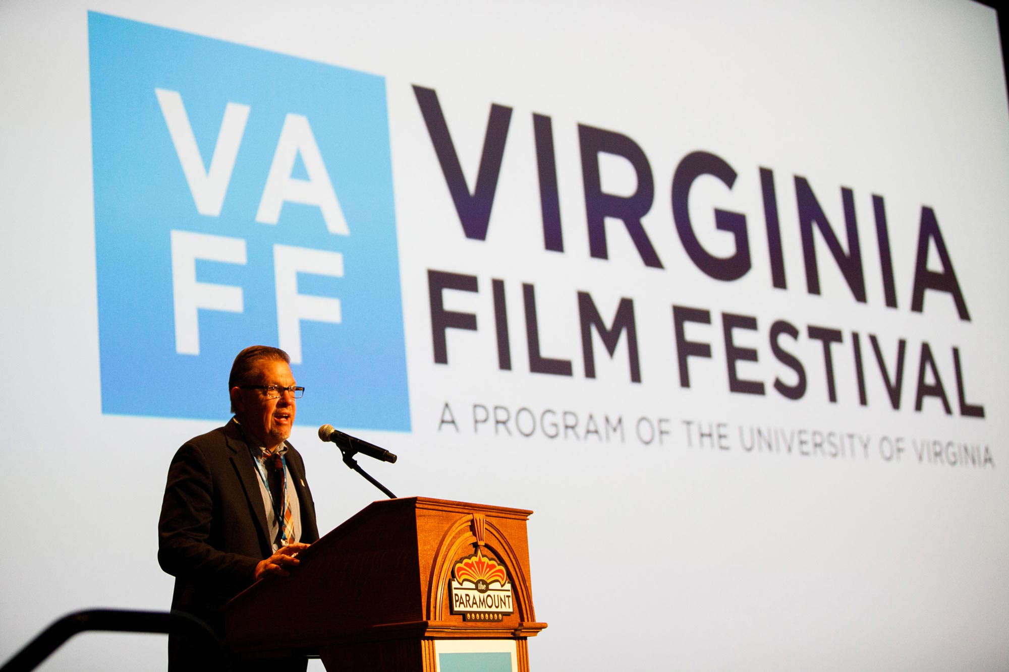 Jody Kielbasa speaking at a podium at the Virginia Film Festival