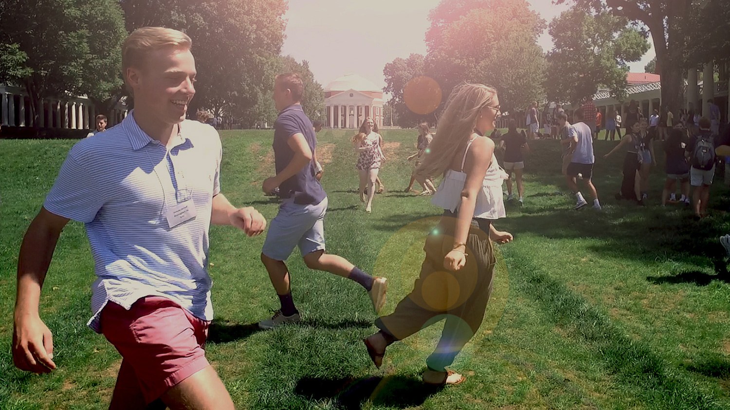 Students running on the Lawn during orientation games