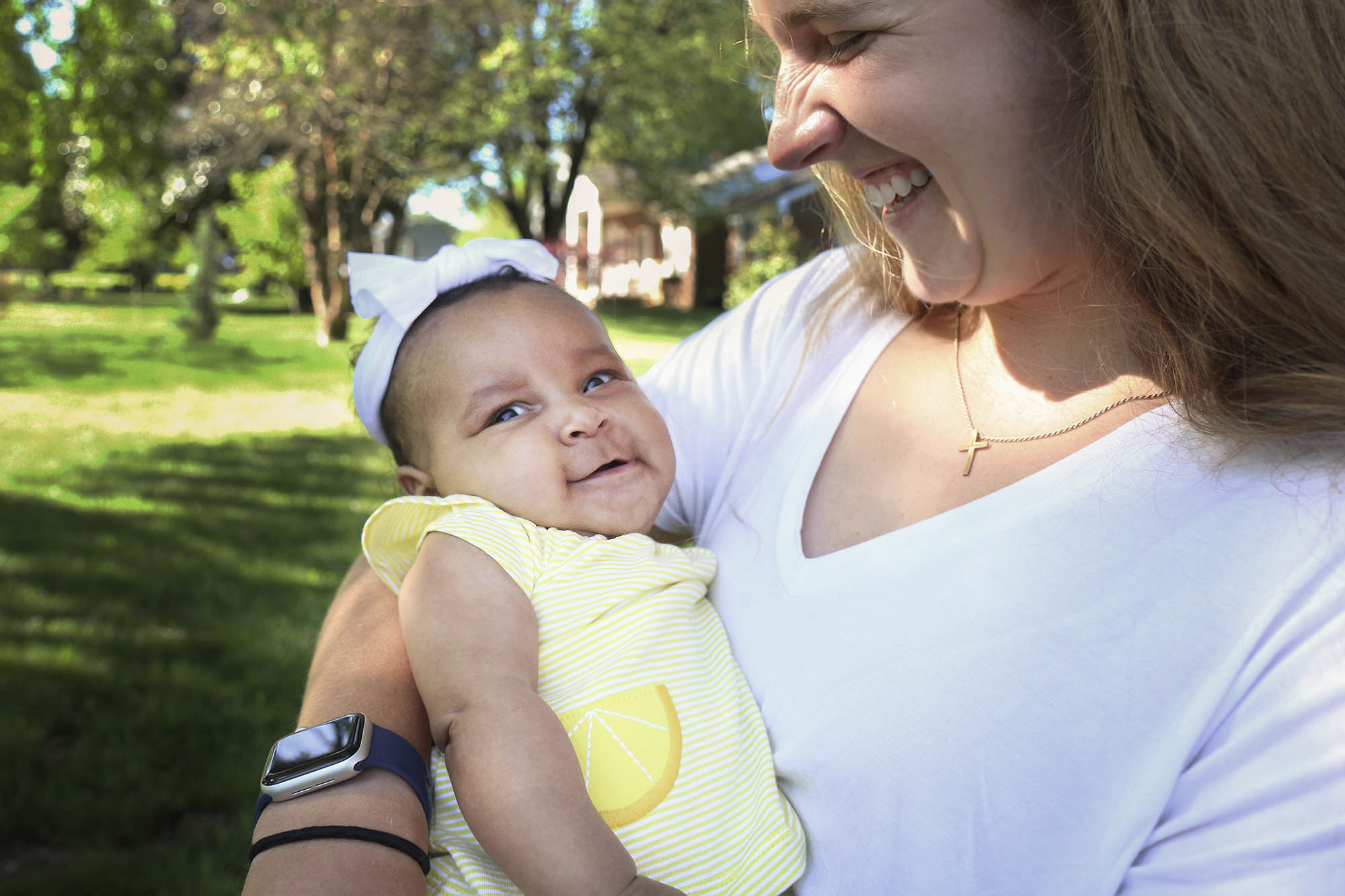 Madi Wilson, holding a baby girl