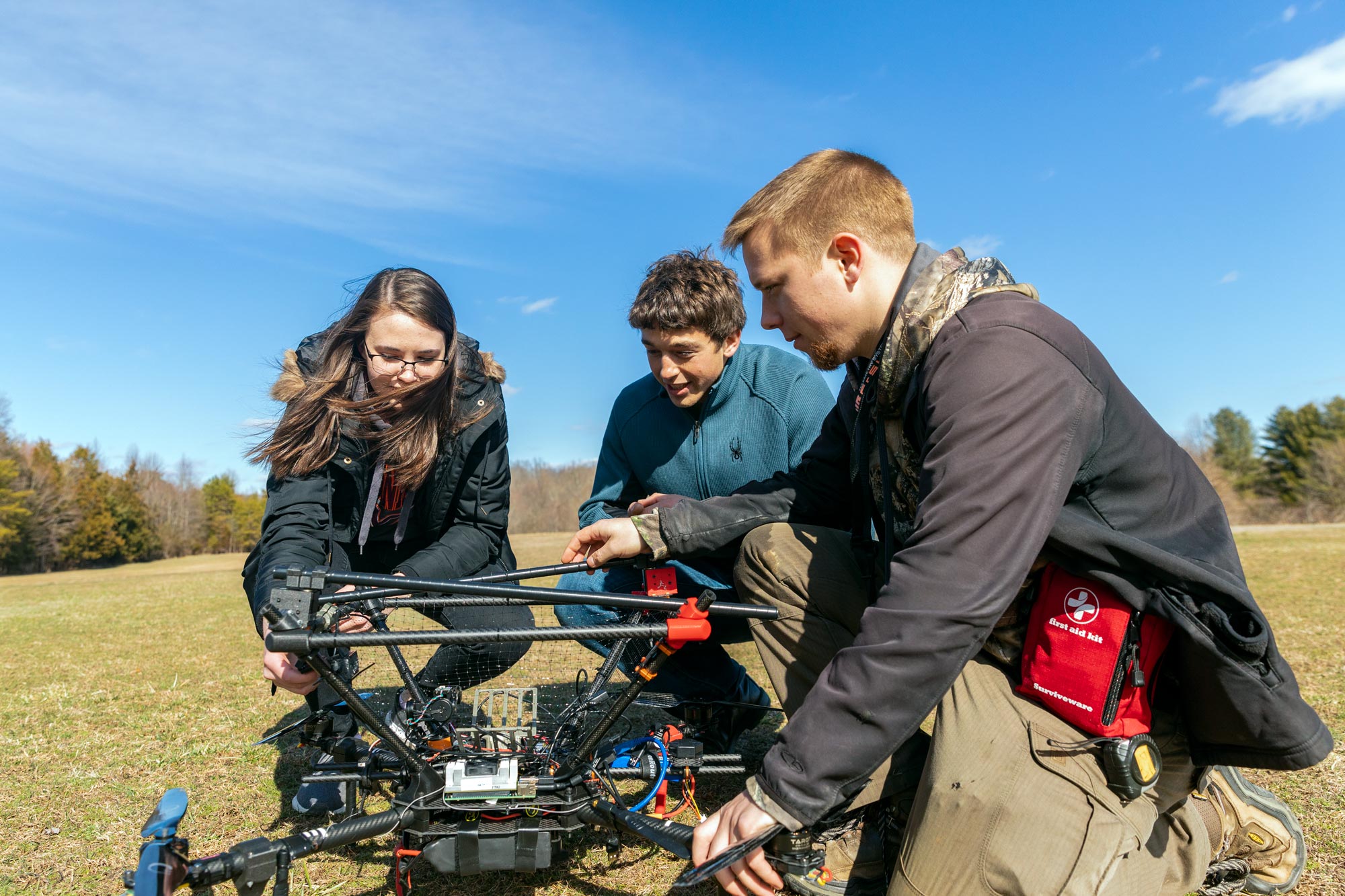 Students from the autonomous robotics team test an aerial drone on UVA’s Milton Field 